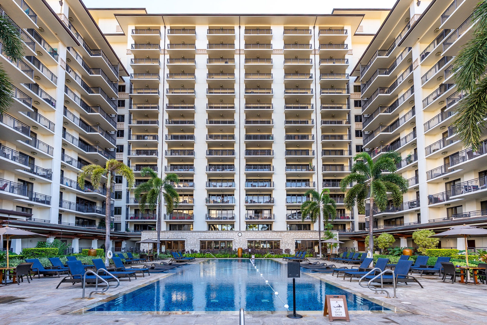 Beat the crowd to the courtyard pool, quiet under the towers.