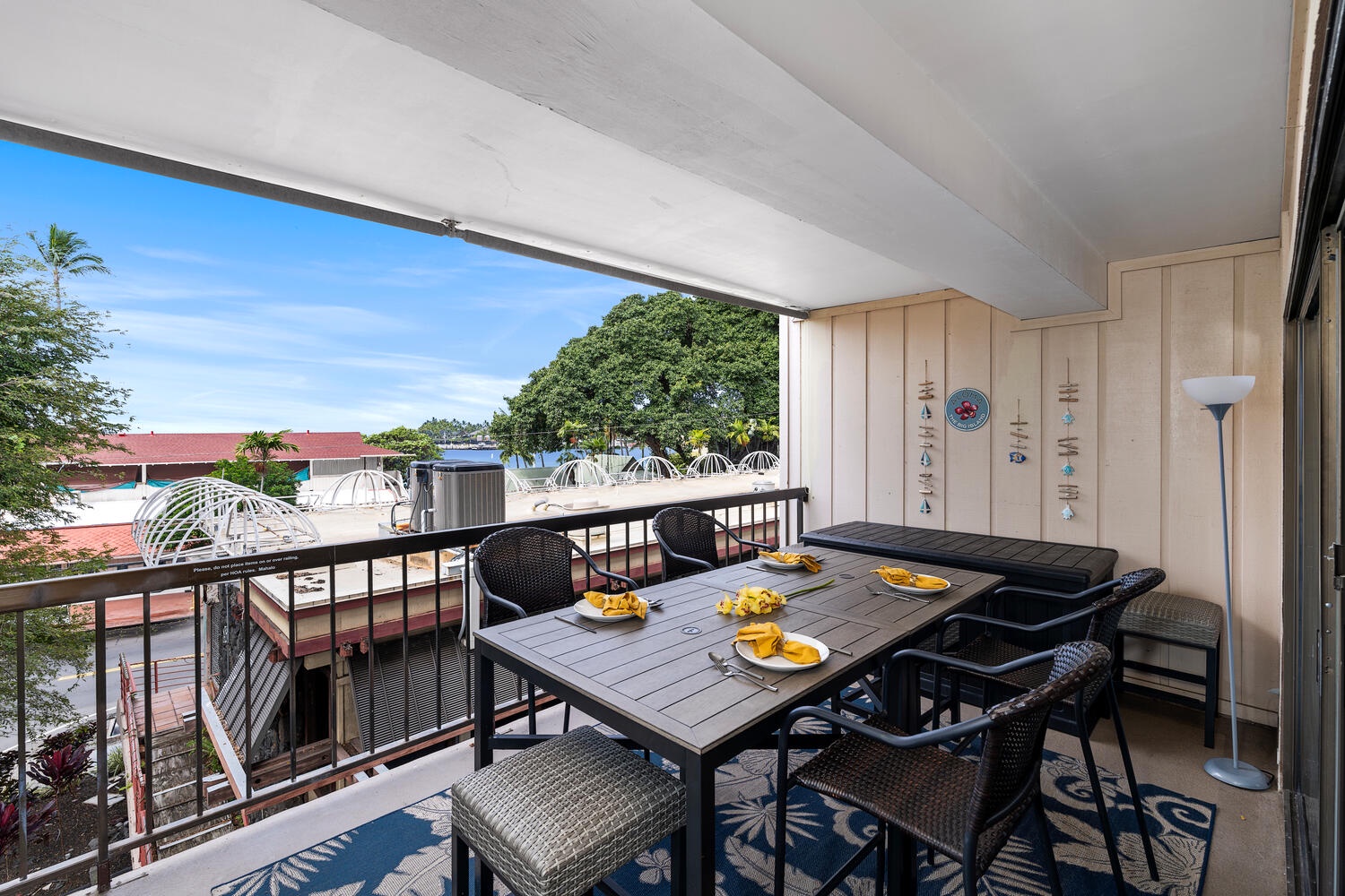 Kailua Kona Vacation Rentals, Kona Plaza 201 - Your private lanai dining awaits with fresh fruit and city views, perfect for morning coffee or sunset meals.