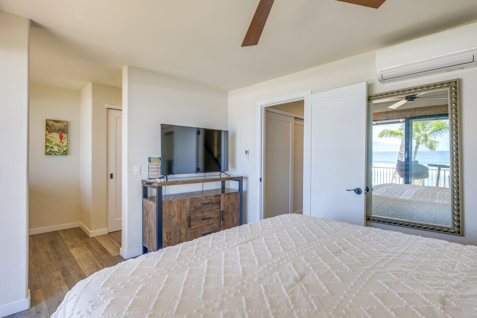 Lahaina Vacation Rentals, Puamana 240-3 - Wake up to soothing ocean views from the comfort of a cozy Primary bedroom.