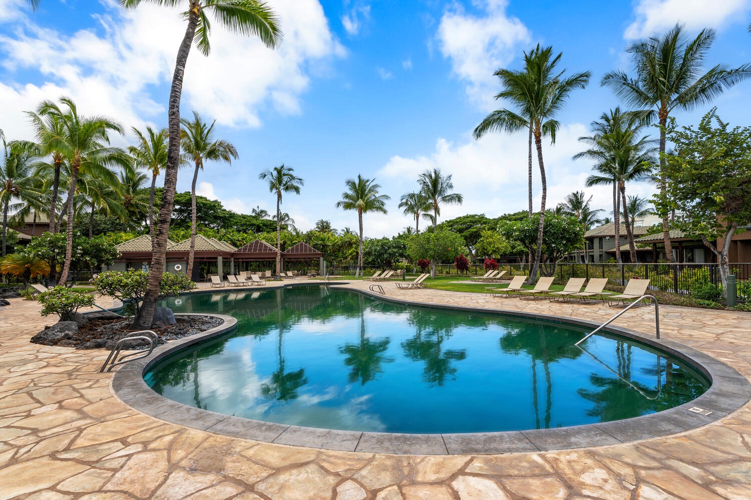 Kamuela Vacation Rentals, Mauna Lani Fairways #902 - The pool area is the perfect Pacific dream.