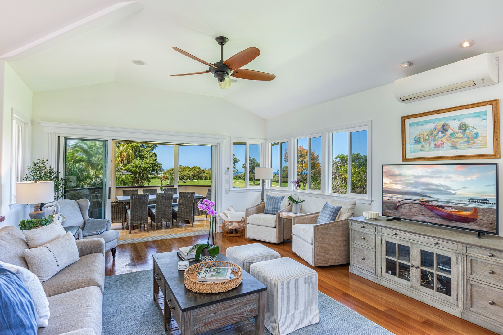 Princeville Vacation Rentals, Ohana Kamalani - Light-filled living space with seamless flow to kitchen and dining areas, ideal for relaxed island living.