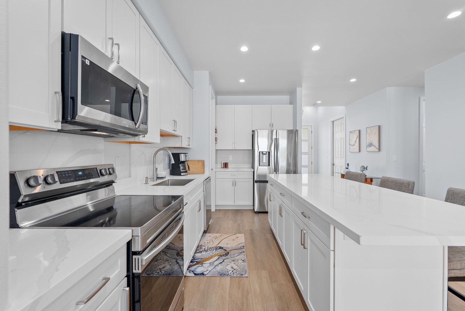 Waianae Vacation Rentals, Oceanfront Luxury Dream Estate - Sleek galley-style kitchen downstairs with stainless steel appliances and deep counters.