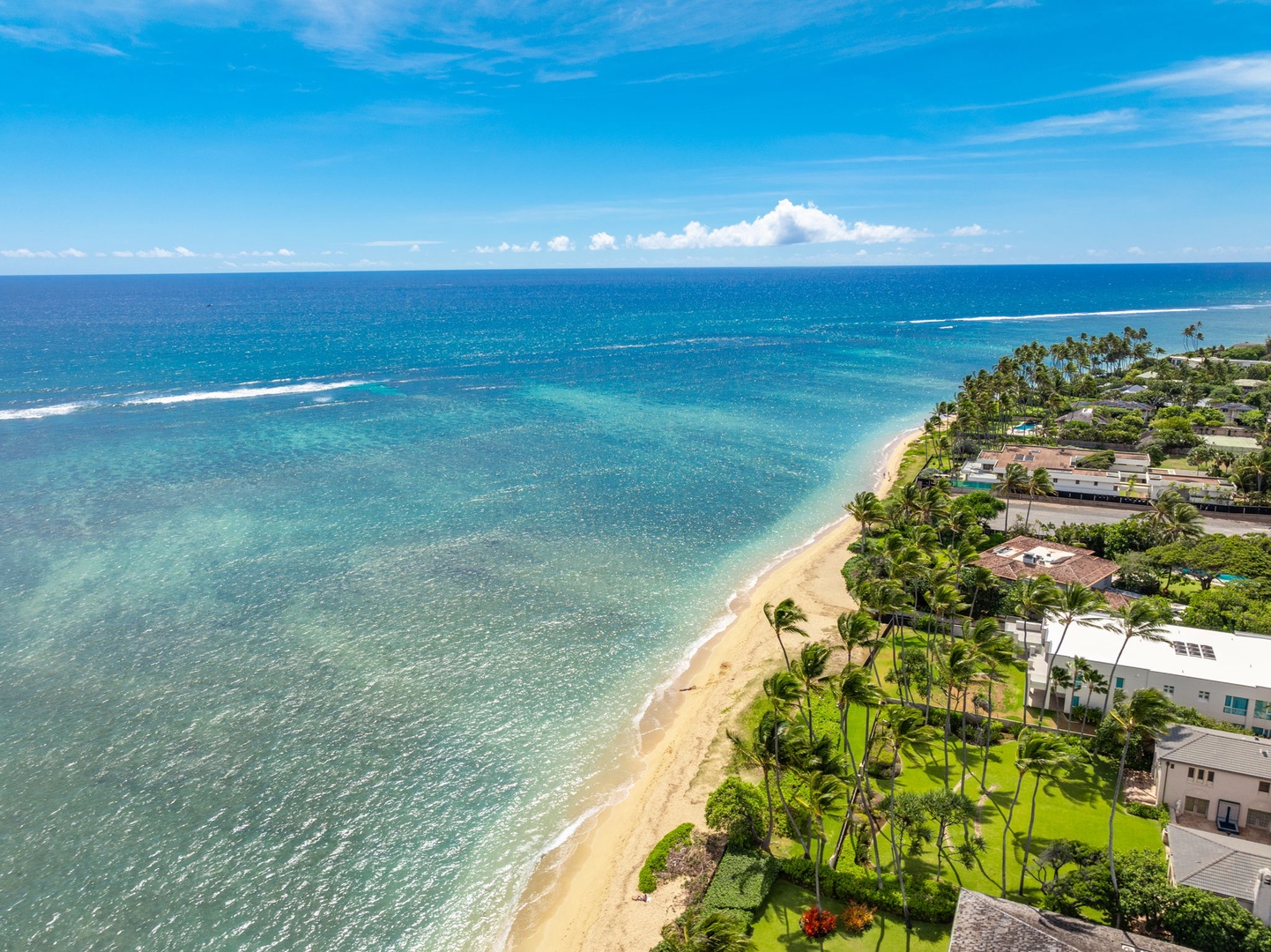 Honolulu Vacation Rentals, Kahala Oasis - Stunning coastal view showcasing the beach and crystal-clear ocean waters, perfect for a tropical getaway.