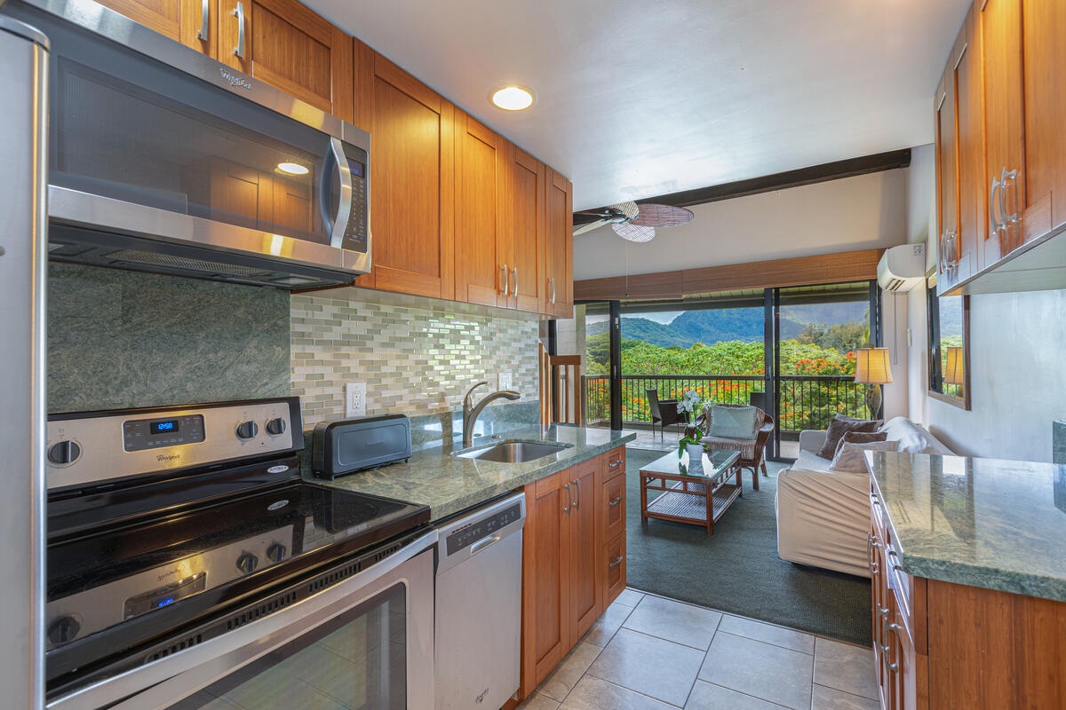 Princeville Vacation Rentals, Hanalei Bay Resort 1535/6 - Convenient kitchen with open views into the living area and beyond.