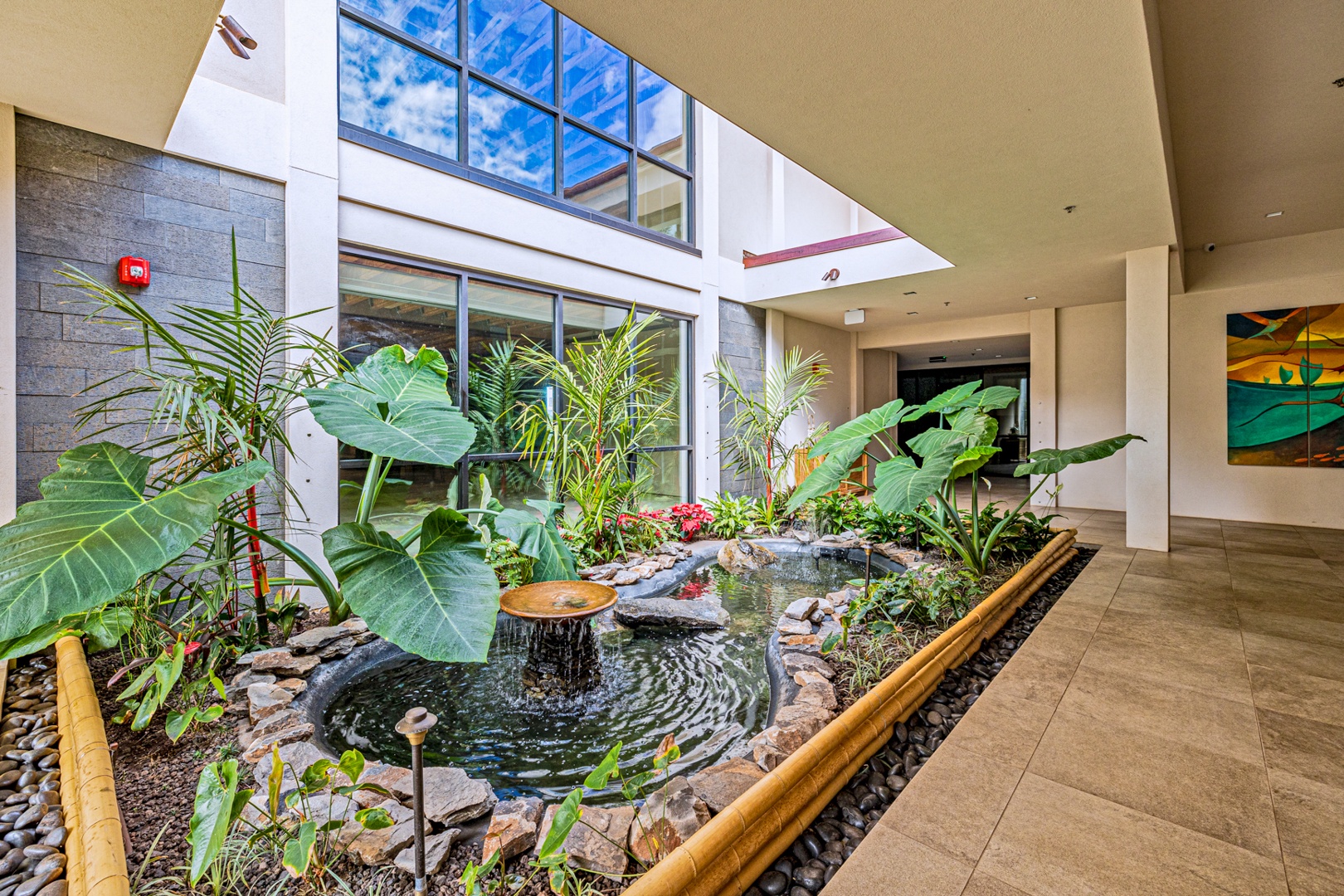 Lahaina Vacation Rentals, Valley Isle 804 - The serene indoor garden with a koi pond adds a peaceful ambiance, inviting you to relax and enjoy the natural beauty surrounding the resort.