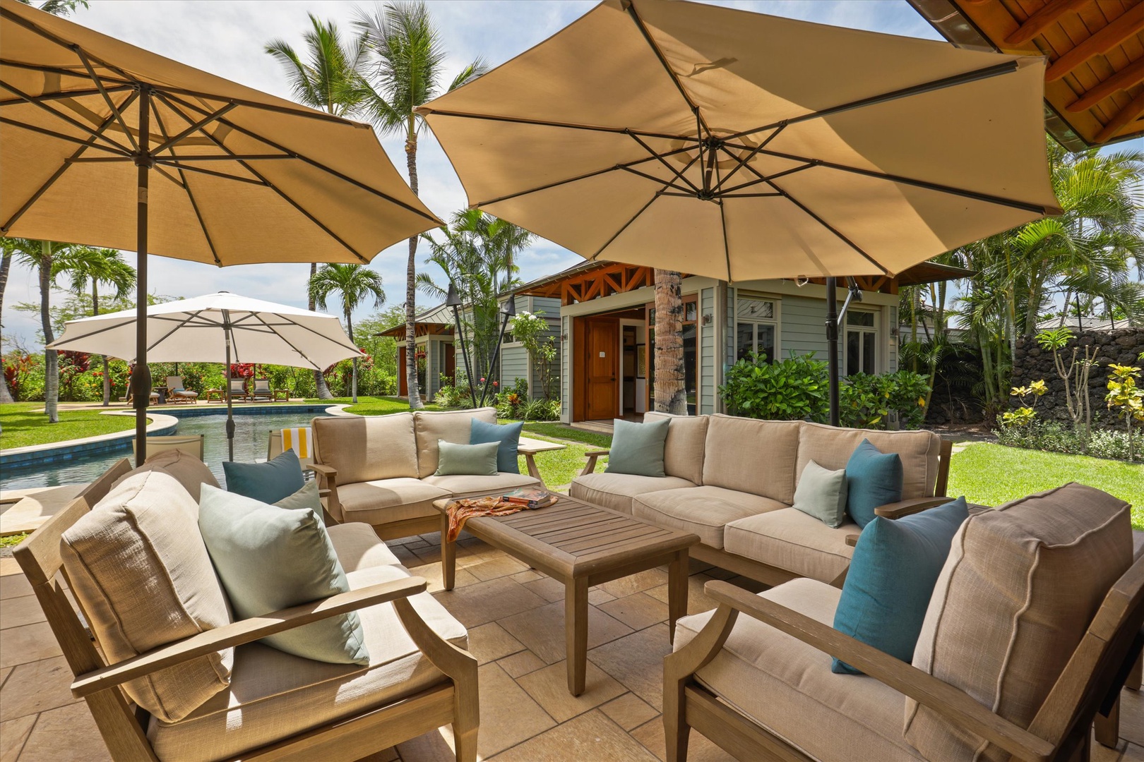 Kamuela Vacation Rentals, 3BD Na Hale 3 at Pauoa Beach Club at Mauna Lani Resort - Stretch out on the shaded outdoor sofa with the lawn and pool spread out ahead.