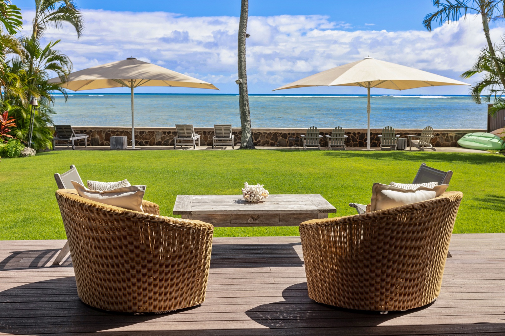 Honolulu Vacation Rentals, Moana Lani - Main House - Settle into the wicker chairs and let the afternoon go by on the water.