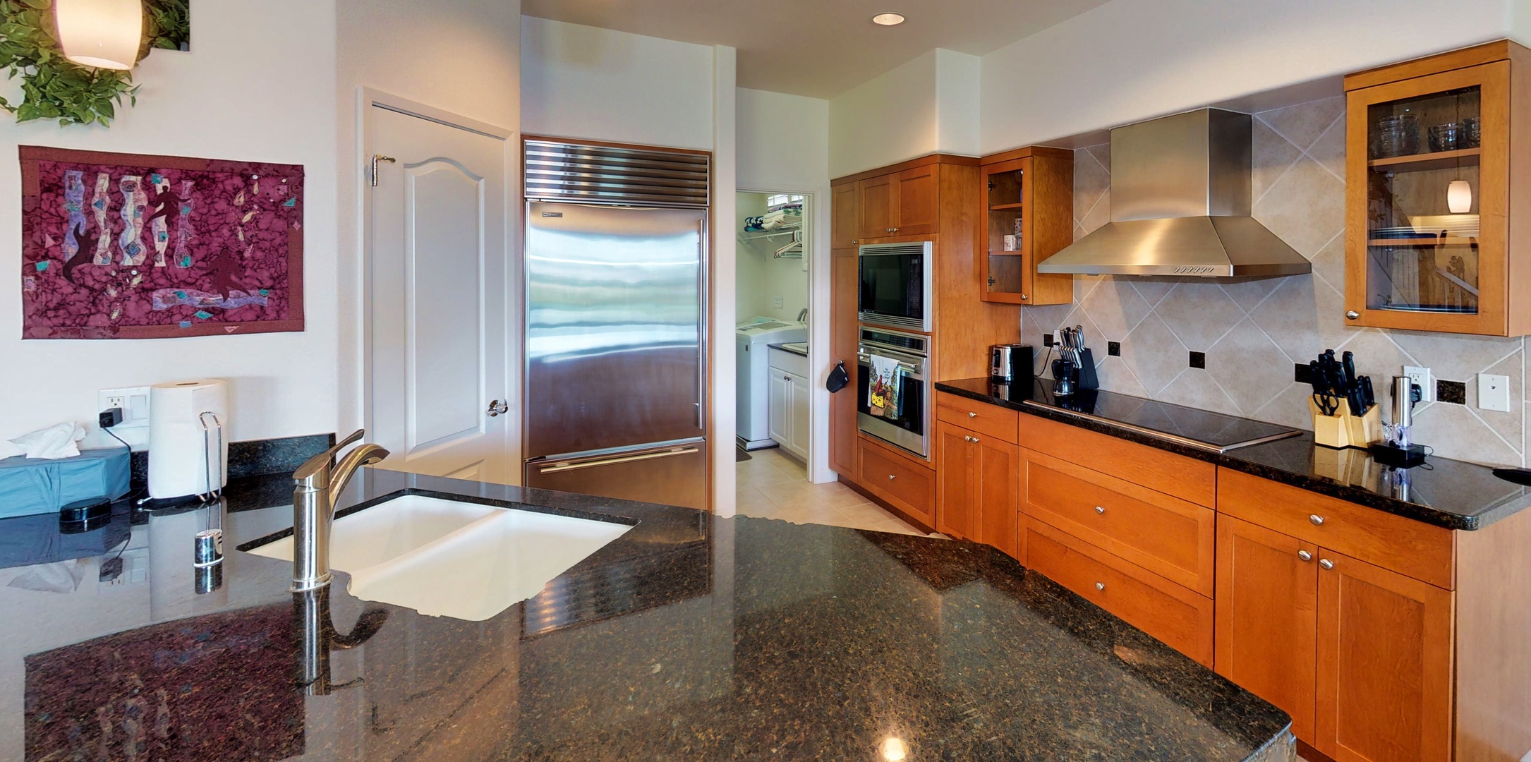 Kapolei Vacation Rentals, Ko Olina Kai Estate #17 - Kitchen equipped with ample wooden cabinetry to store all your culinary essentials.