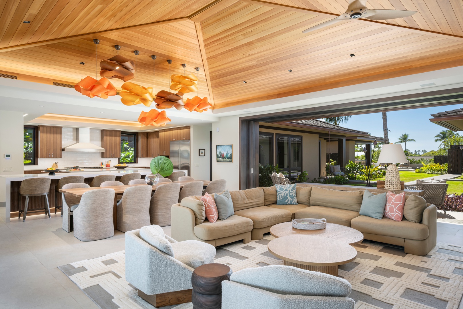 Kailua-Kona Vacation Rentals, 4BD Ka'Ulu Estate (102A) at Hualalai Resort - Sink into plush sectional seating beneath soaring wood ceilings while vibrant pendant lights create a warm glow in this open-concept living space.