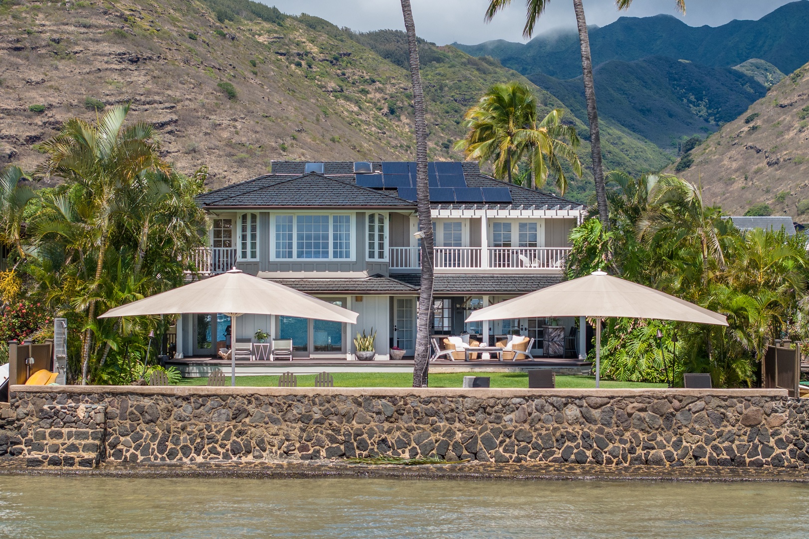 Honolulu Vacation Rentals, Moana Lani - Ocean-facing view of Moana Lani with spacious lanais and shaded lounges.