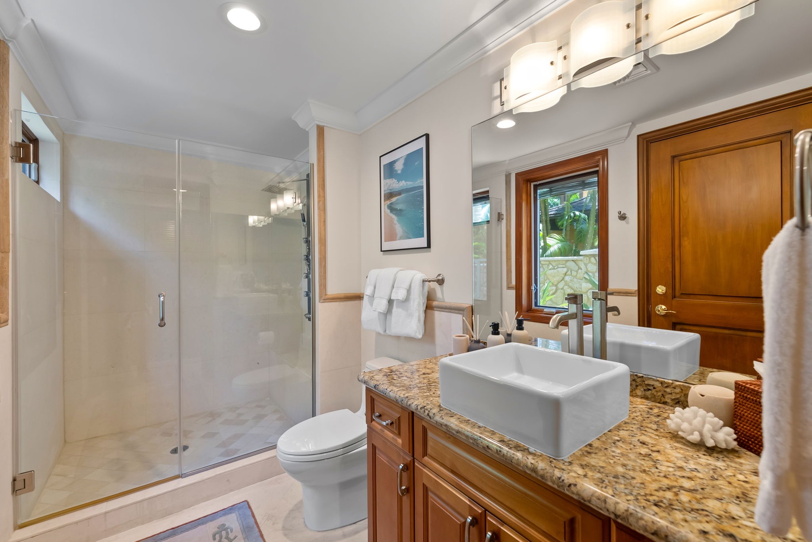 Honolulu Vacation Rentals, Maunalua Estate - Granite finishes, a glass shower, and thoughtful details bring a spa-like feel to the bathroom.