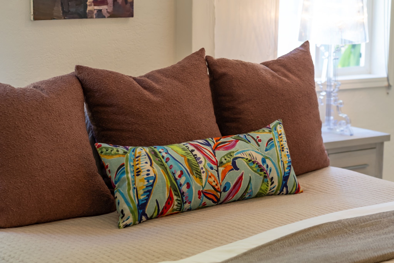 Honolulu Vacation Rentals, Ho'okipa Villa - Sink into plush pillows and a cozy bed where you'll find comfort and style perfectly blended, with natural light streaming through the window to brighten your stay.