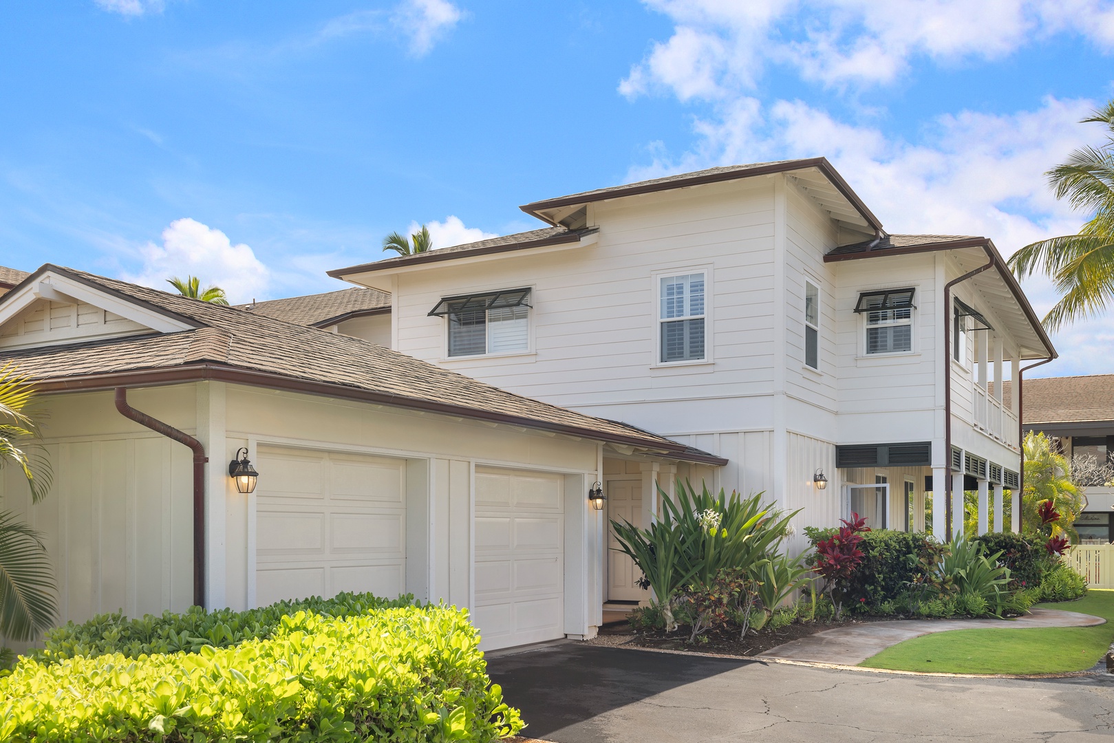 Kapolei Vacation Rentals, Coconut Plantation 1078-3 - Outside view of the two-story home with a spacious garage and lush landscaping.