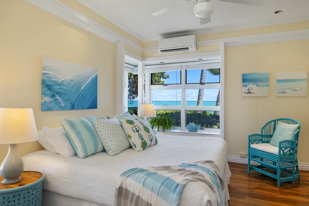 Kailua Vacation Rentals, Lanikai Seashore - The primary bedroom has views of the beach and ocean, a king bed, and ensuite bath