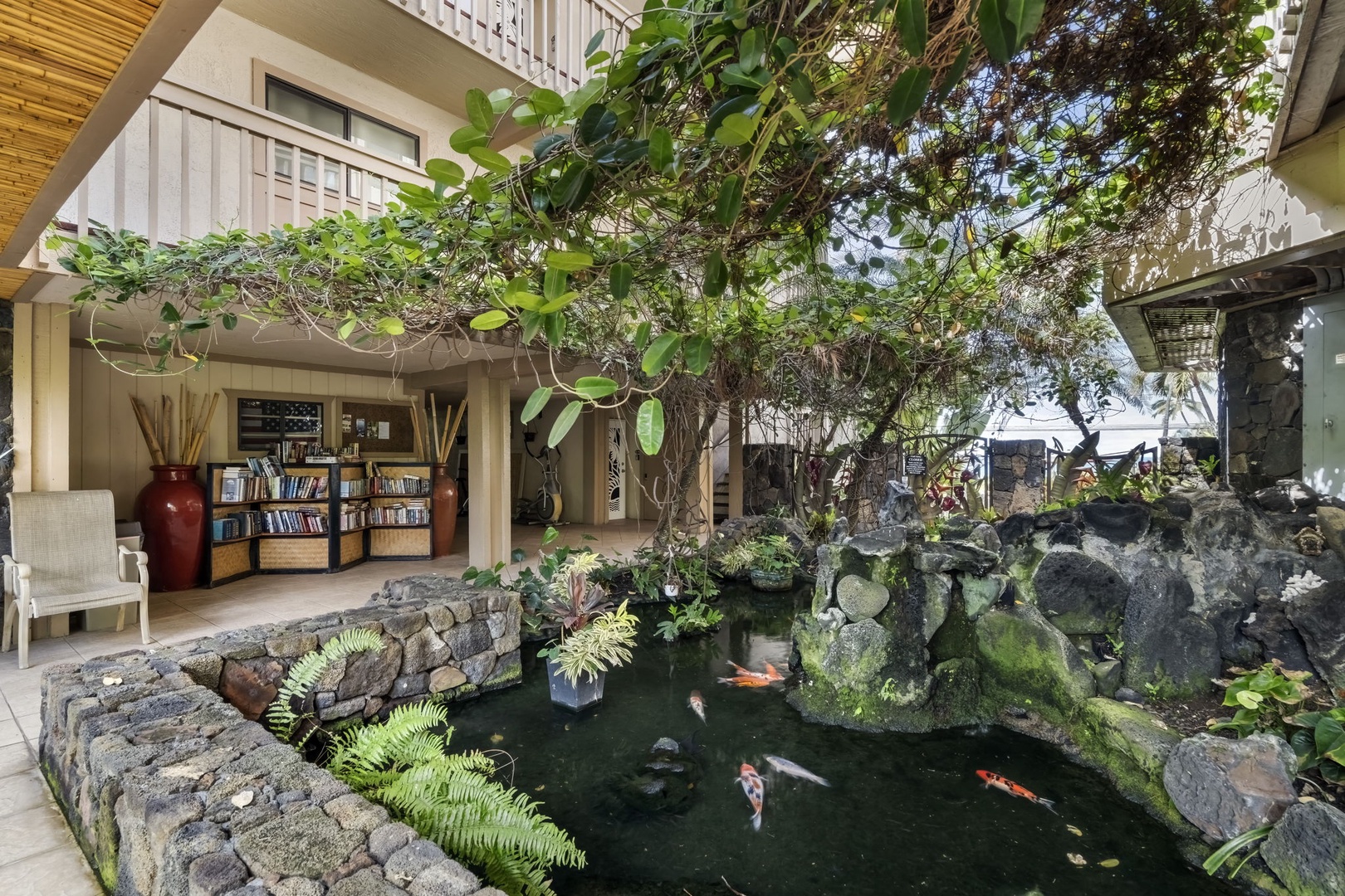 Kailua Kona Vacation Rentals, Royal Kahili 401A - Charming koi pond nestled within the lush tropical courtyard, creating a peaceful ambiance.