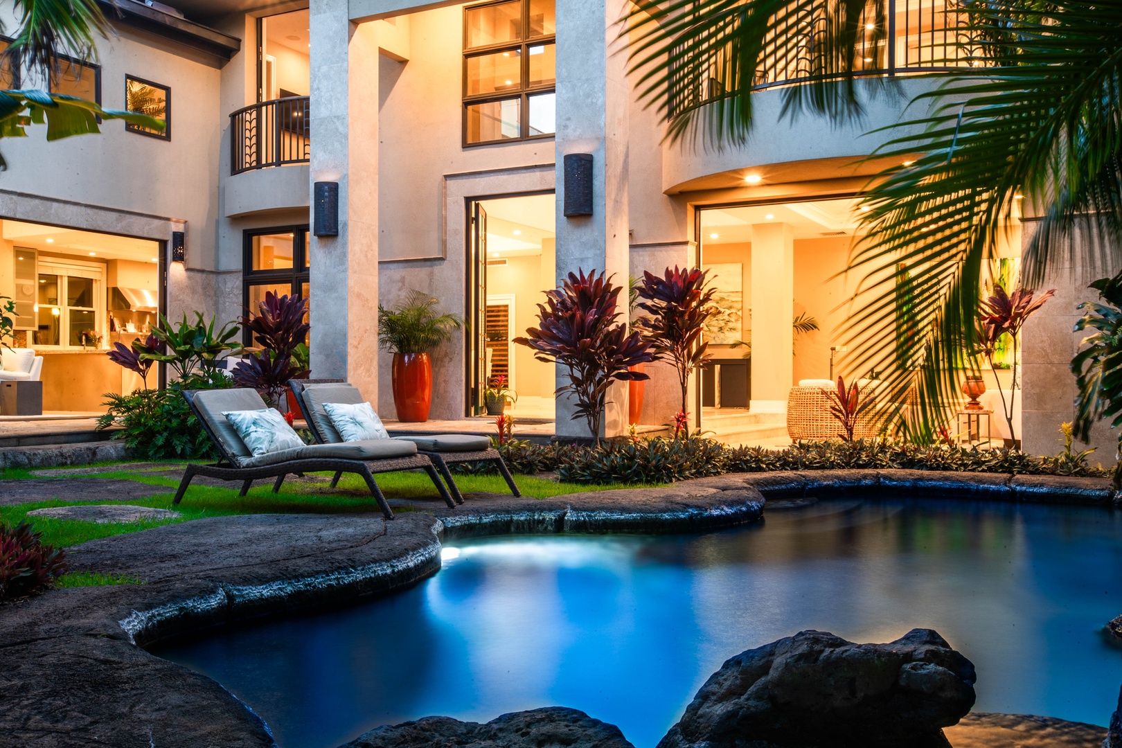 Honolulu Vacation Rentals, Pili Pono - Evening glow at the poolside—relax and unwind in tropical luxury.