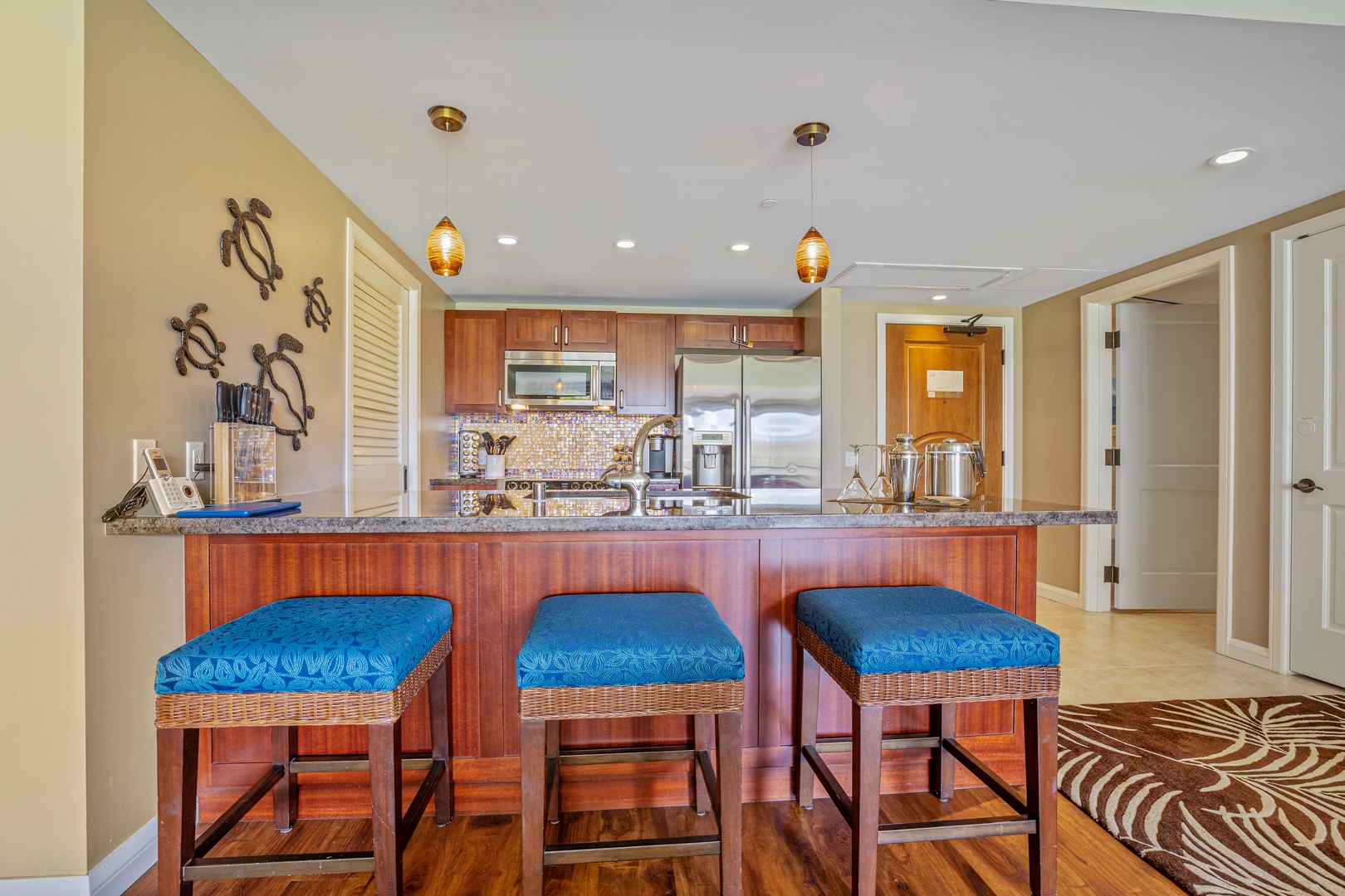 Lahaina Vacation Rentals, Honua Kai Konea 204 - The kitchen’s breakfast bar offers a convenient spot to enjoy a quick meal or gather for conversation while cooking.