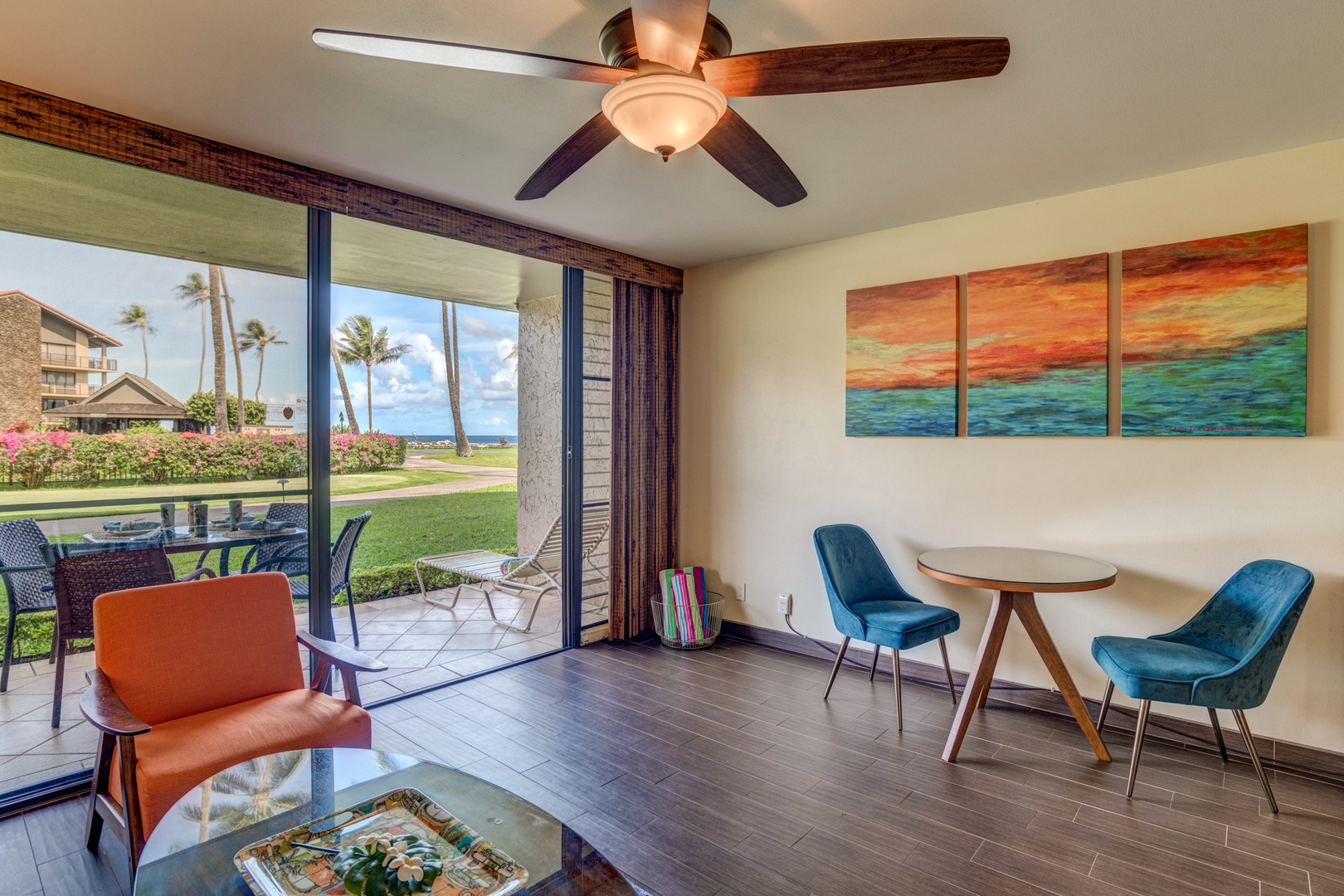 Lahaina Vacation Rentals, Papakea B-105 - The living area opens up to a serene outdoor space, providing a peaceful setting with beautiful garden views.