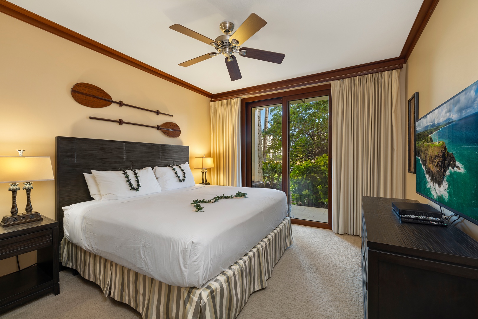 Kapolei Vacation Rentals, Ko Olina Beach Villas B107 - The primary guest bedroom with access to the lanai.