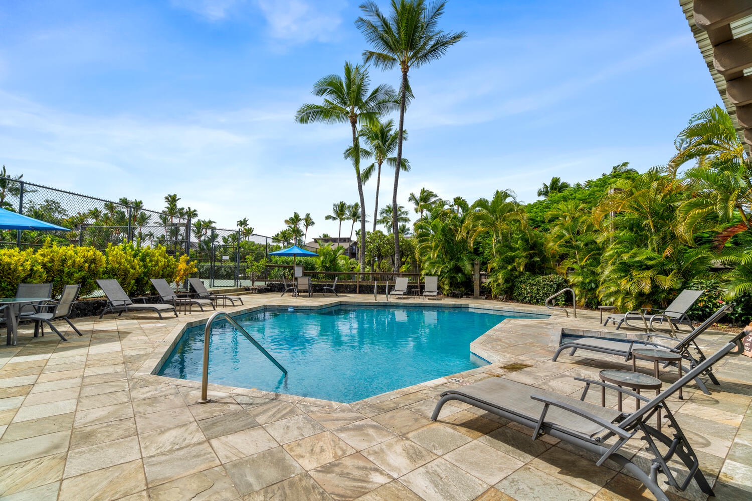 Kailua Kona Vacation Rentals, Kanaloa at Kona 3303 - The pool area has loungers and Hawaii sunshine!