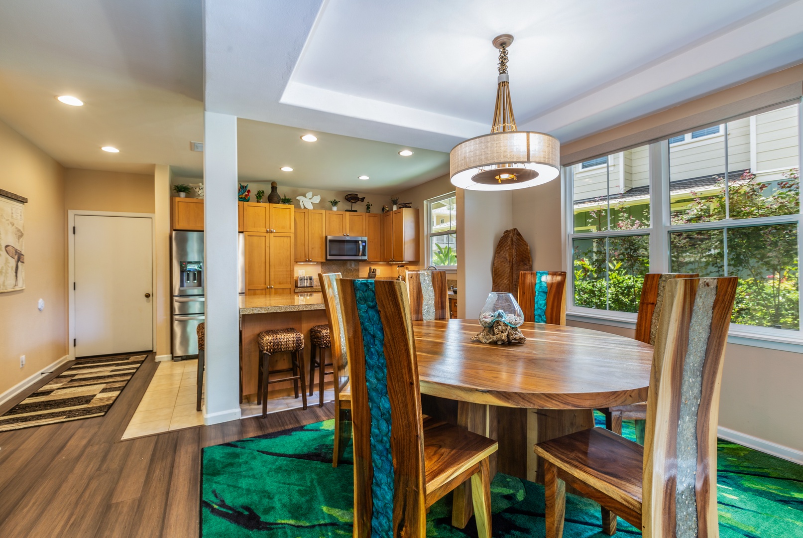 Princeville Vacation Rentals, Pualani Villa - A dining area with seating for six offers a cozy space for meals and conversation.