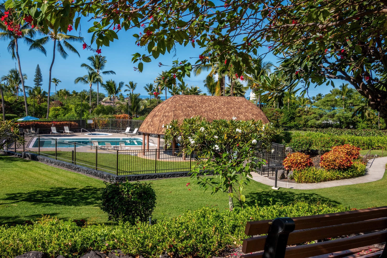 Kailua Kona Vacation Rentals, Keauhou Kai C301 - Tropical planting all around the pool lawn with the pavilion holding the shade.