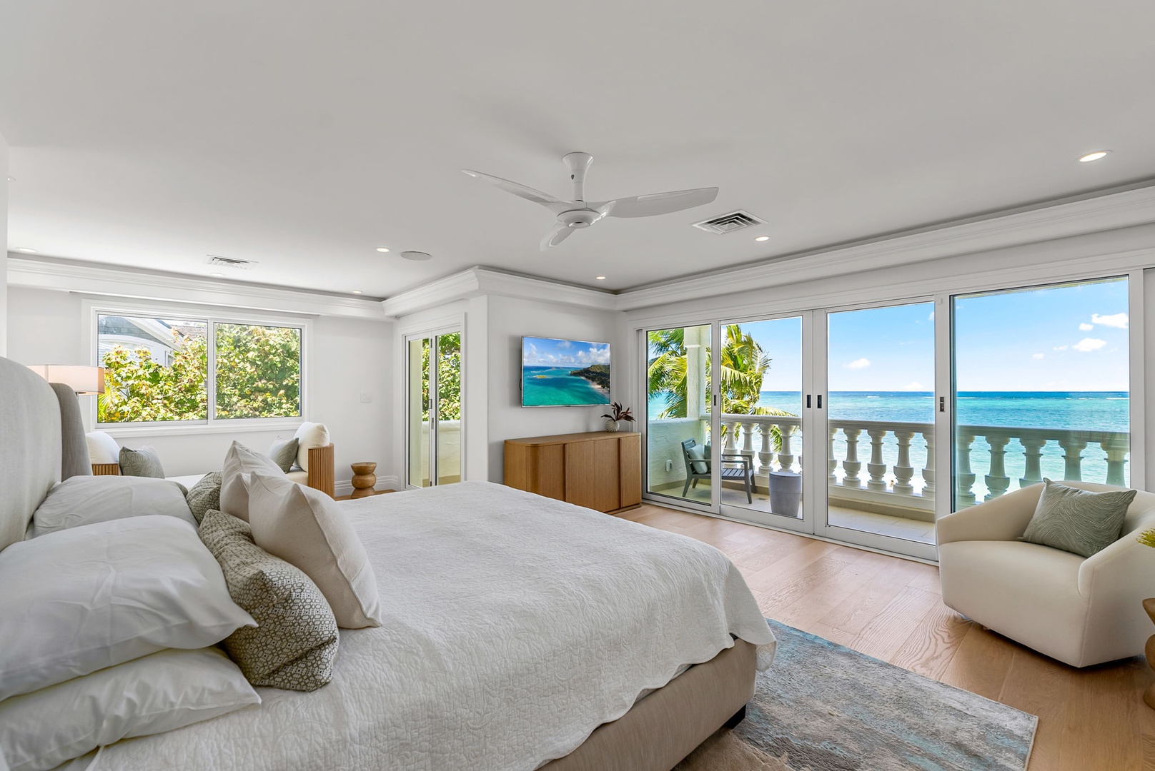 Kailua Vacation Rentals, Lanikai Sunrise Estate - Primary suite with a king bed, two private lanais, and sweeping views of the Pacific for a serene start to each day.