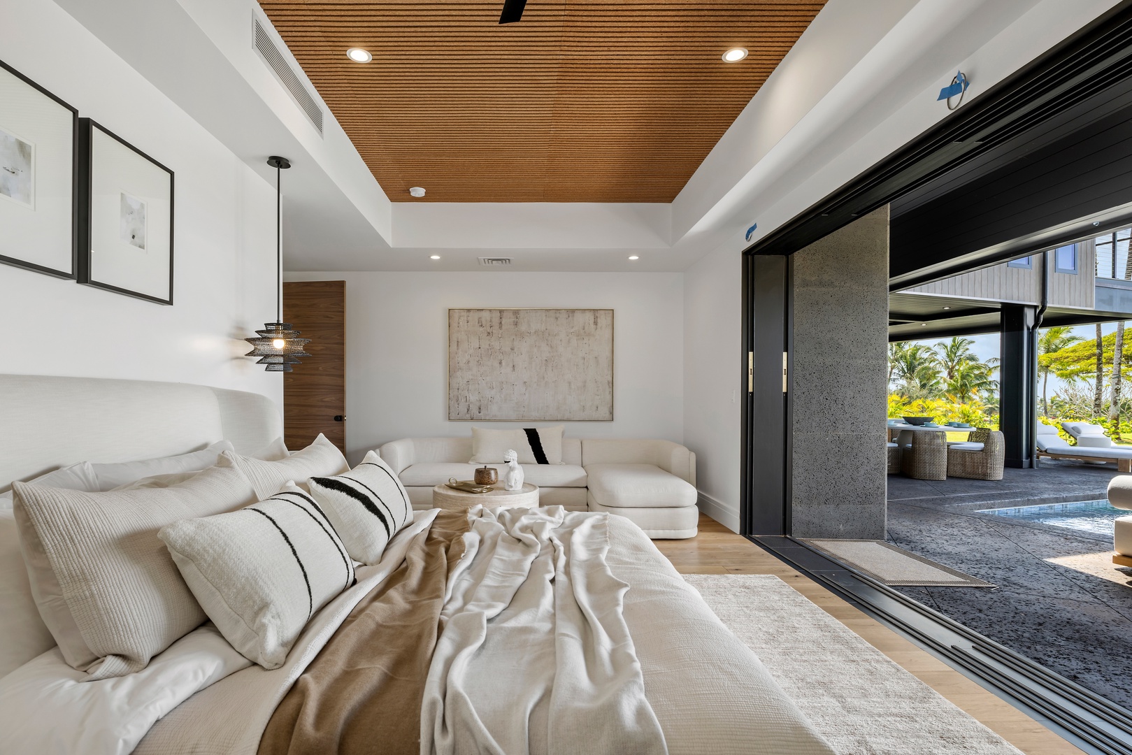 Koloa Vacation Rentals, Hale o ka Nene - Relax in your luxurious primary suite with a plush king bed, where warm wood ceilings and soft textures invite peaceful mornings.