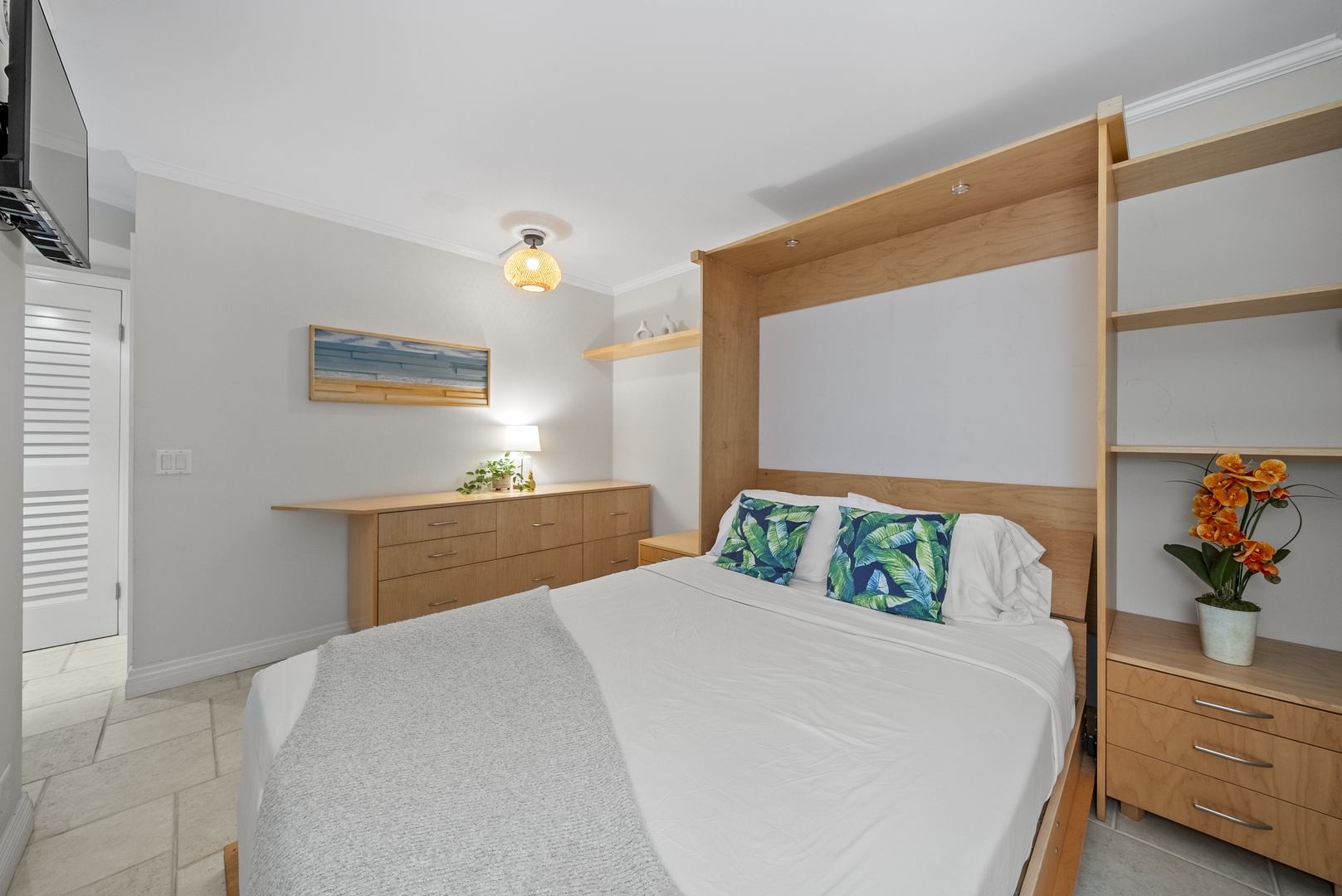 Honolulu Vacation Rentals, Aston Waikiki Beach Tower 602 - Revel in the convenience of a Murphy queen bed second guest bedroom that transforms your space effortlessly.