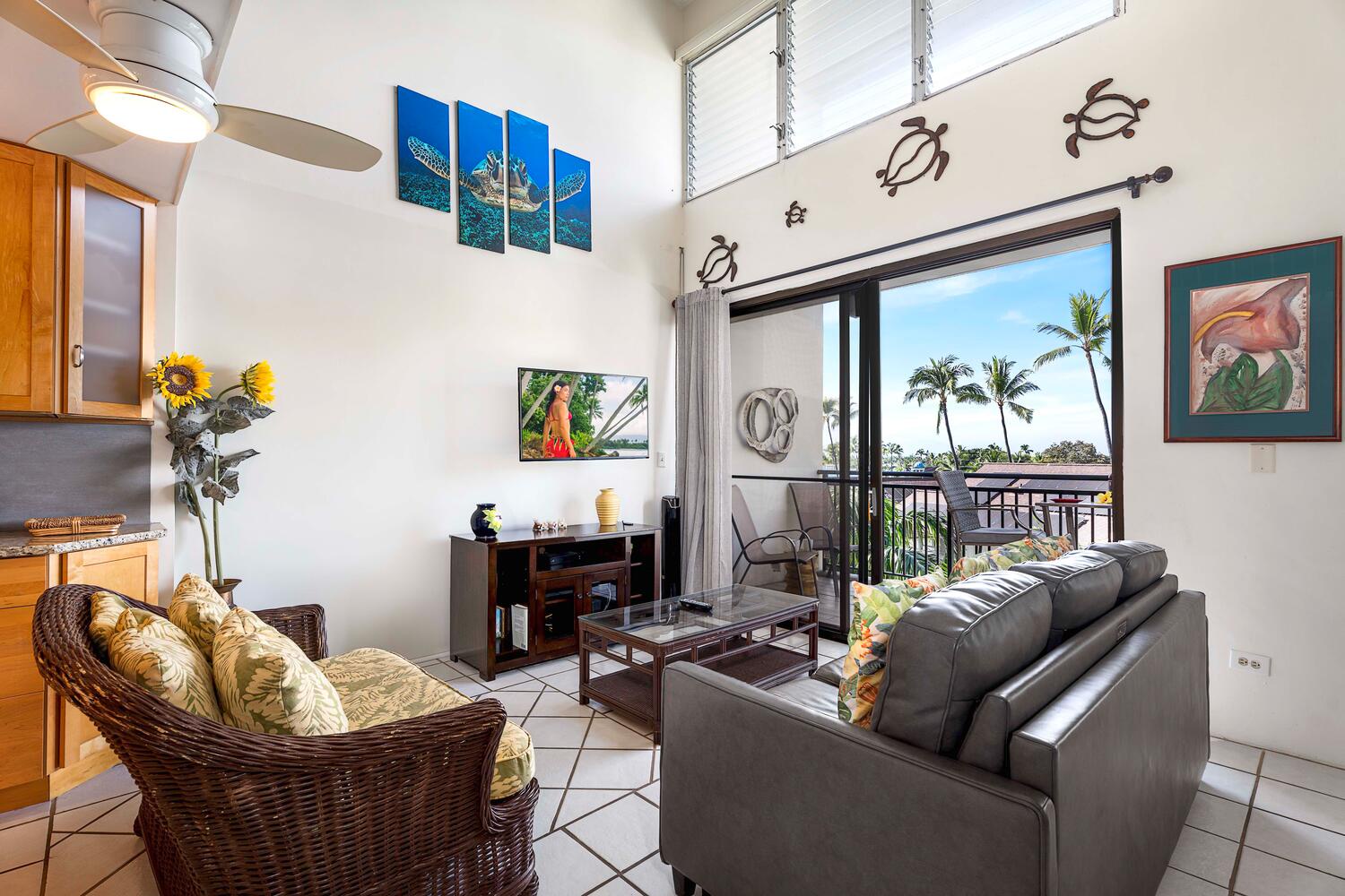 Kailua Kona Vacation Rentals, Kona Alii 512 - Chic decor and tropical vibes in a living space that opens to ocean breezes on the lanai.