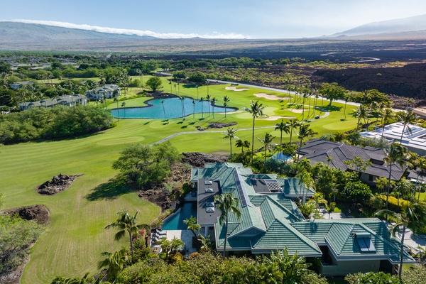 Kamuela Vacation Rentals, Canoe House & Beach Walker at Champion Ridge - Aerial view of Canoe House at Champion Ridge, a luxurious home overlooking a scenic golf course and lush landscapes