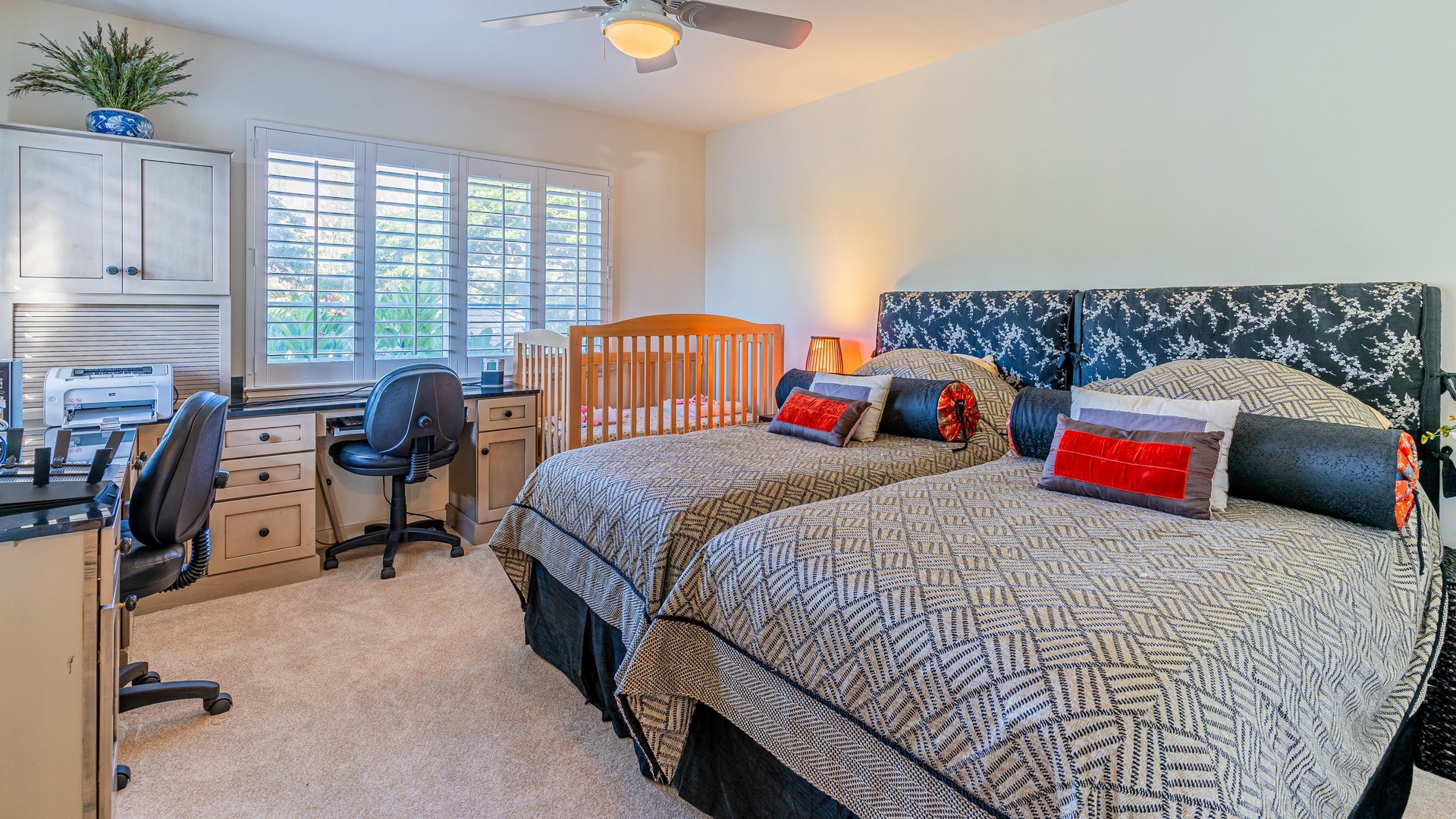 Kapolei Vacation Rentals, Kai Lani 16C - The spacious second guest bedroom with two beds and a desk.