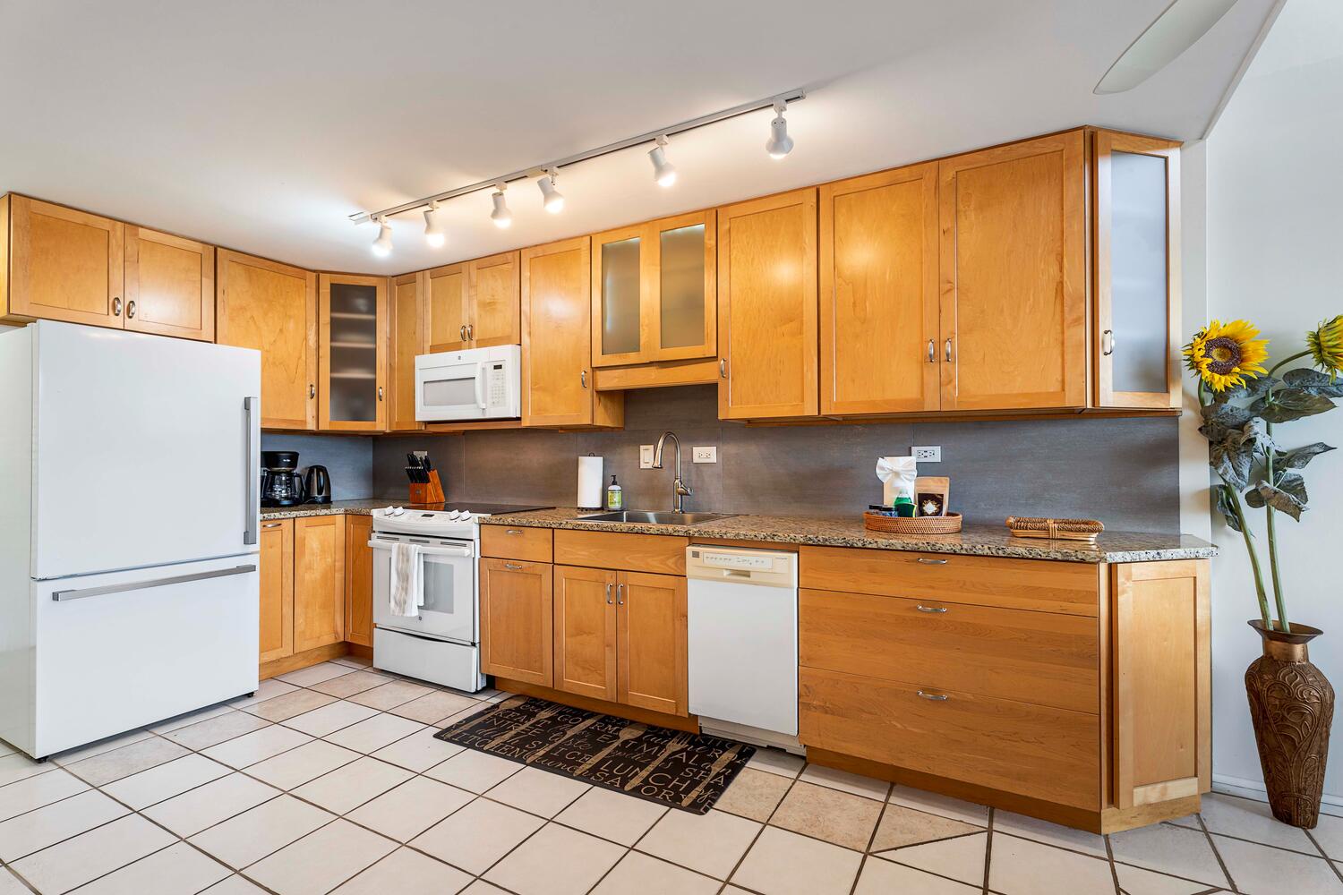 Kailua Kona Vacation Rentals, Kona Alii 512 - The kitchen area with ample space to whip up your favorite meals.