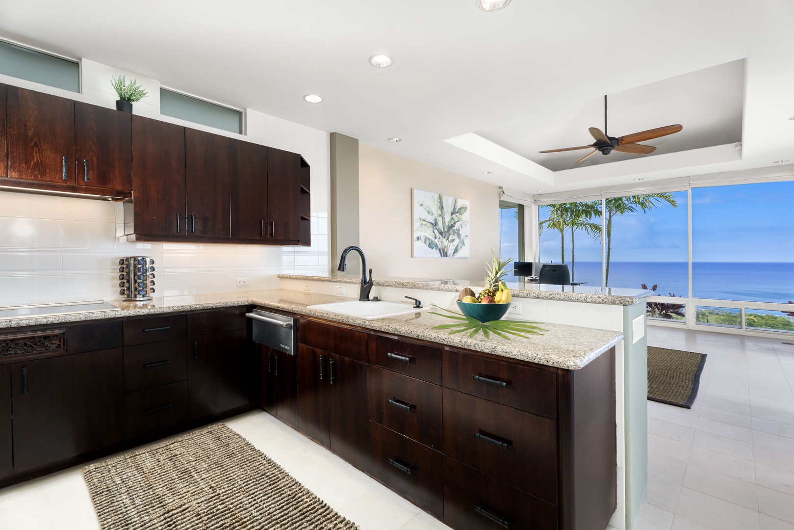 Kailua Kona Vacation Rentals, Hale Nai'a - Cook with endless ocean views through floor-to-ceiling windows in your sleek modern kitchen with granite counters and premium appliances.