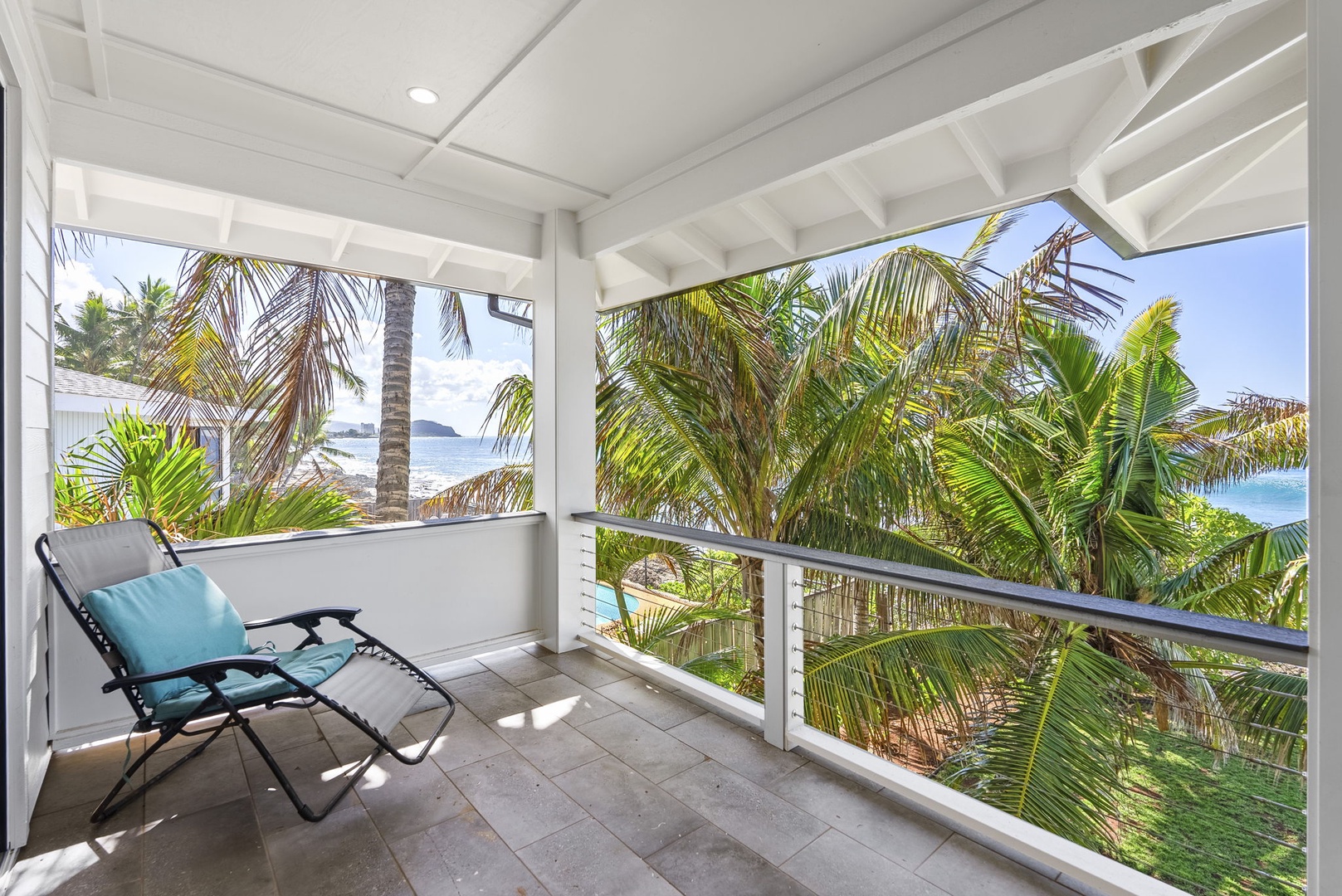 Waianae Vacation Rentals, Oceanfront Luxury Dream Estate - Covered lanai with lounge seating and tropical shade, perfect for relaxing in privacy and comfort.