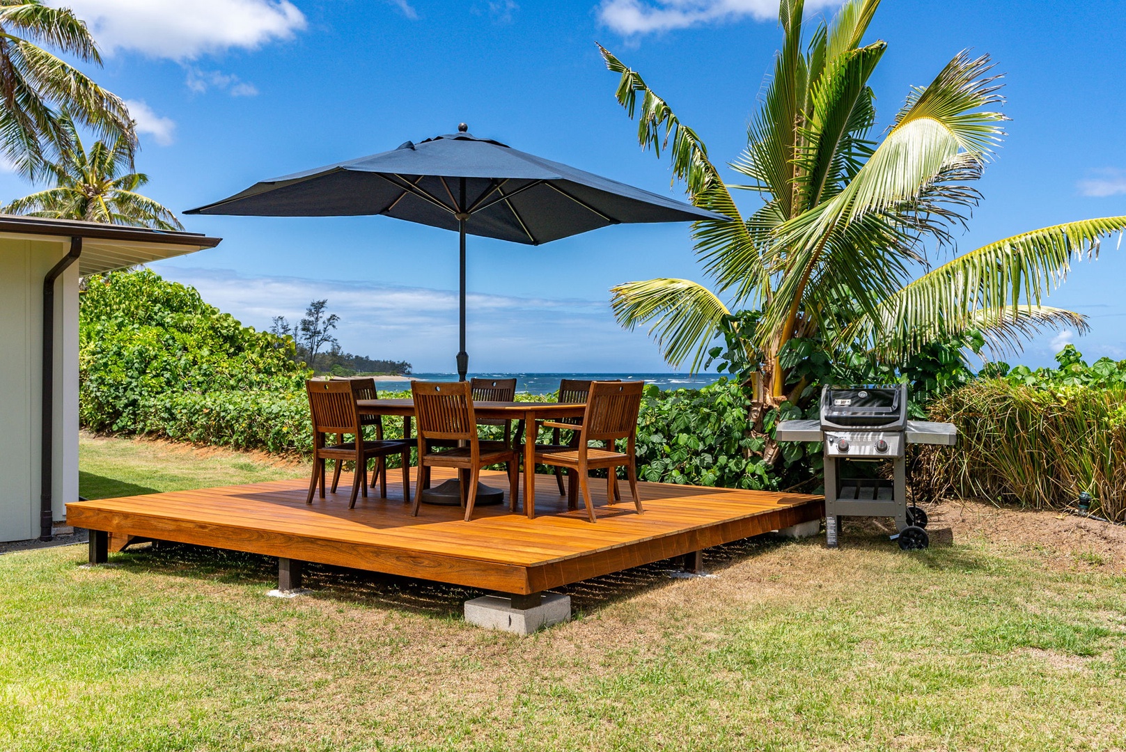 Waialua Vacation Rentals, Mokuleia Beach Villa** - Gather around the BBQ area for a cookout.