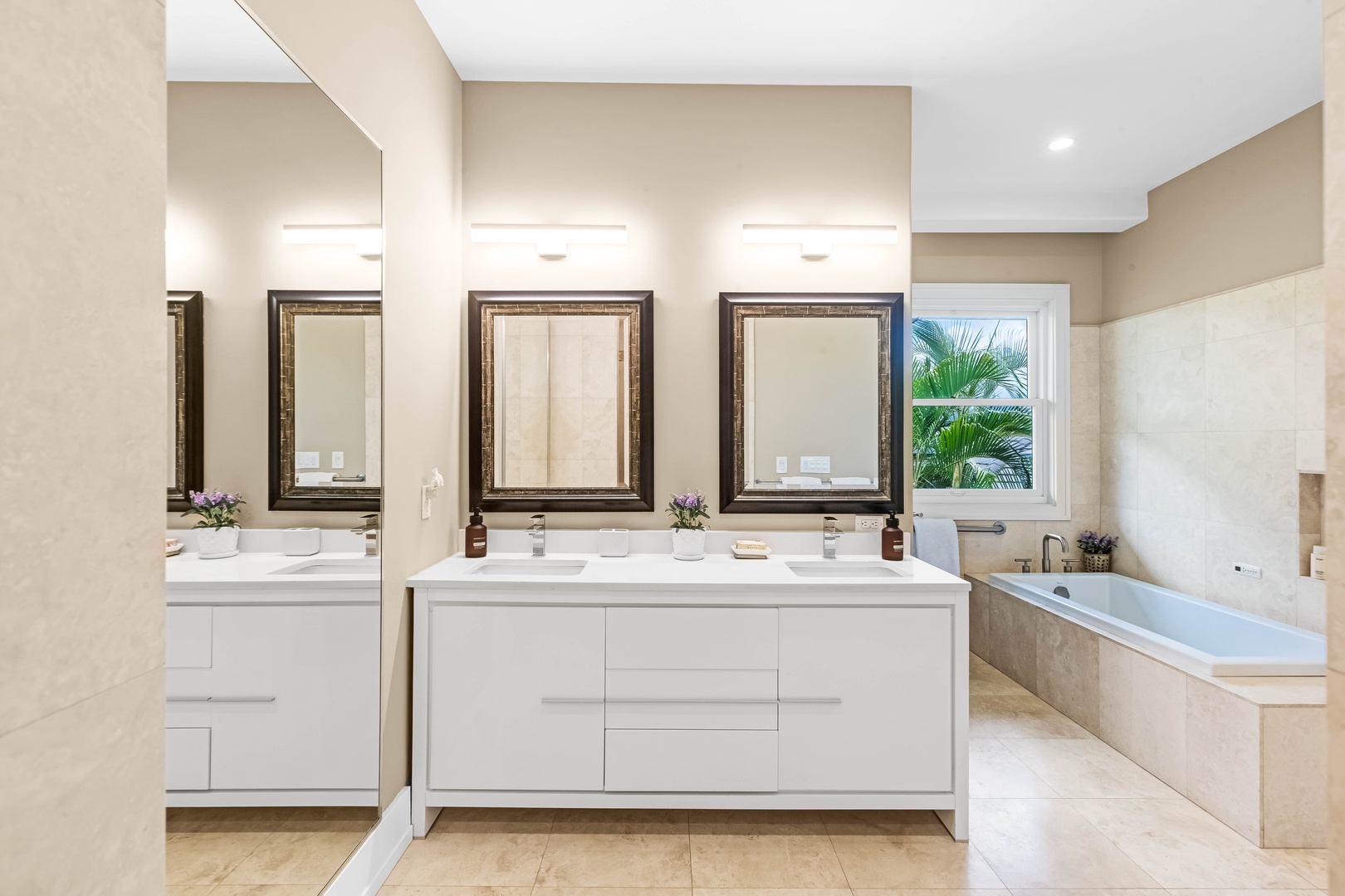 Honolulu Vacation Rentals, Pili Pono - Double-sink vanity with mirrors and soft lighting in the main en-suite.