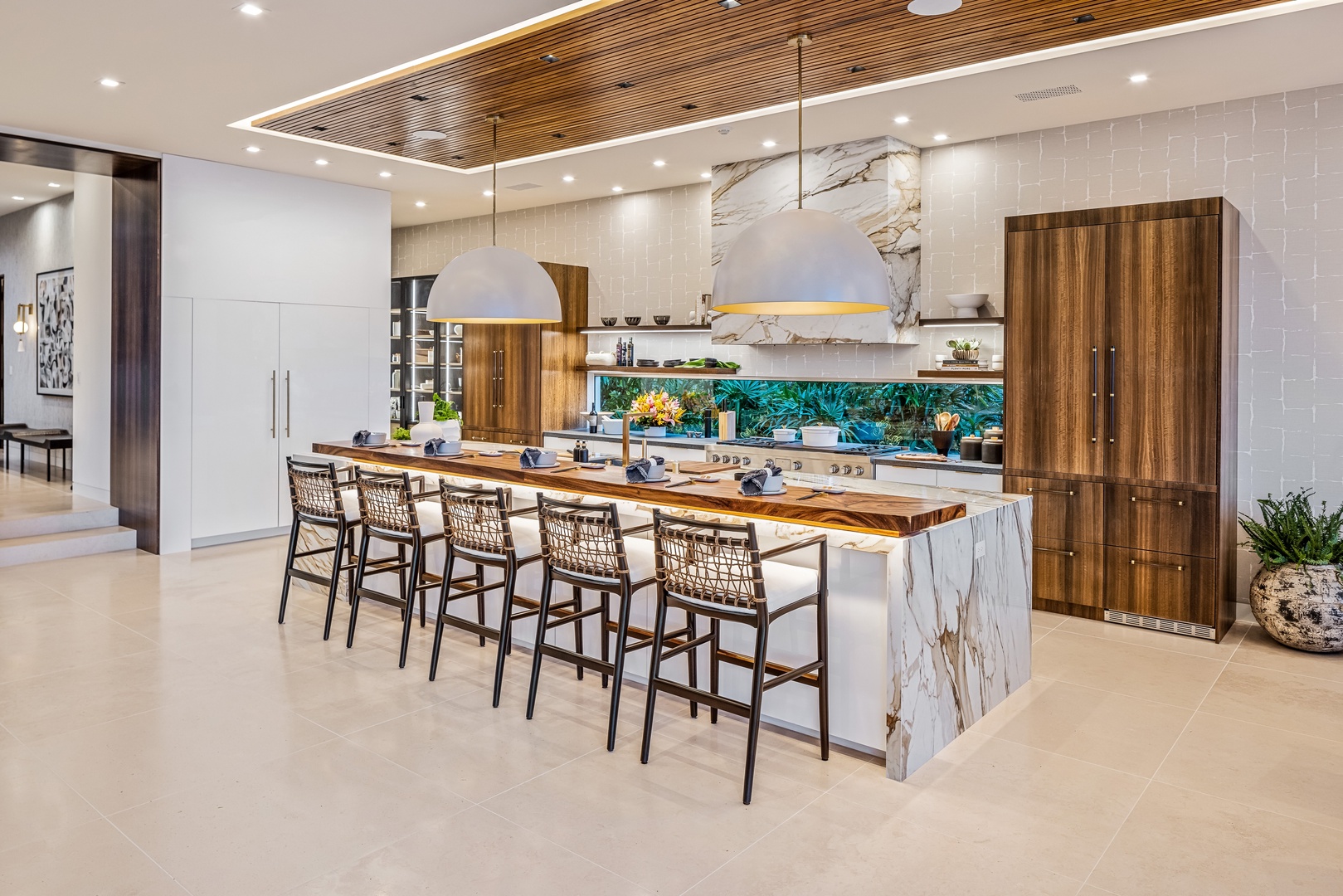 Honolulu Vacation Rentals, Diamond Head Grand Escape - Prepare meals together in the gourmet kitchen, featuring marble counters, high-end appliances, and a spacious island with bar seating.