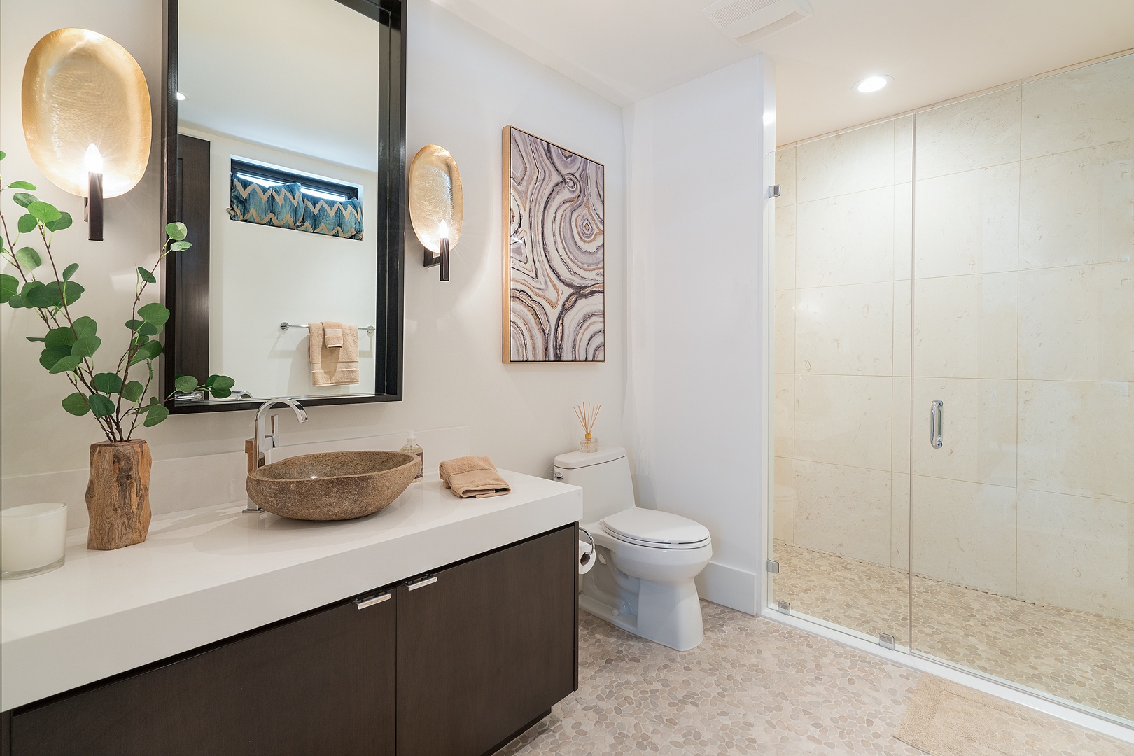 Honolulu Vacation Rentals, Diamond Head Grandeur - This guest bathroom boasts a walk-in shower and sleek vanity, ensuring a relaxing space to refresh after a day of surfing or sightseeing.