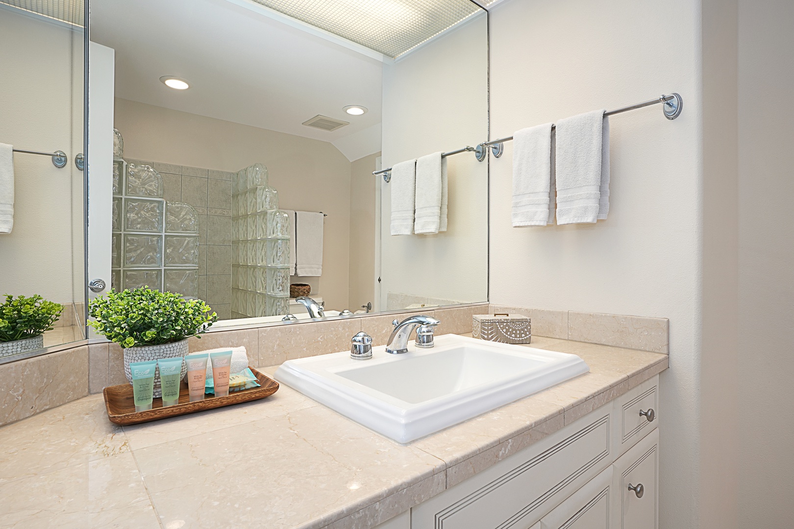 Princeville Vacation Rentals, Ku'u Lei Villa - Refresh and rejuvenate in the spa-like primary bathroom, complete with a spacious vanity and glass-enclosed shower.