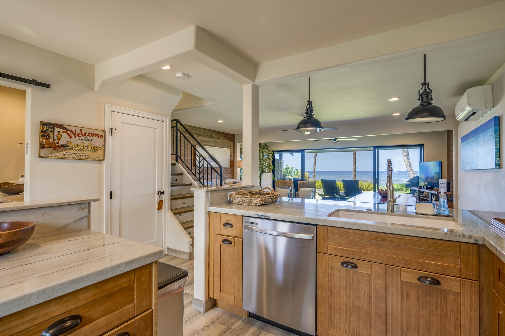Lahaina Vacation Rentals, Puamana 240-3 - Enjoy seamless indoor-outdoor living with ocean views from the kitchen and dining area — perfect for relaxed mornings or evening gatherings.