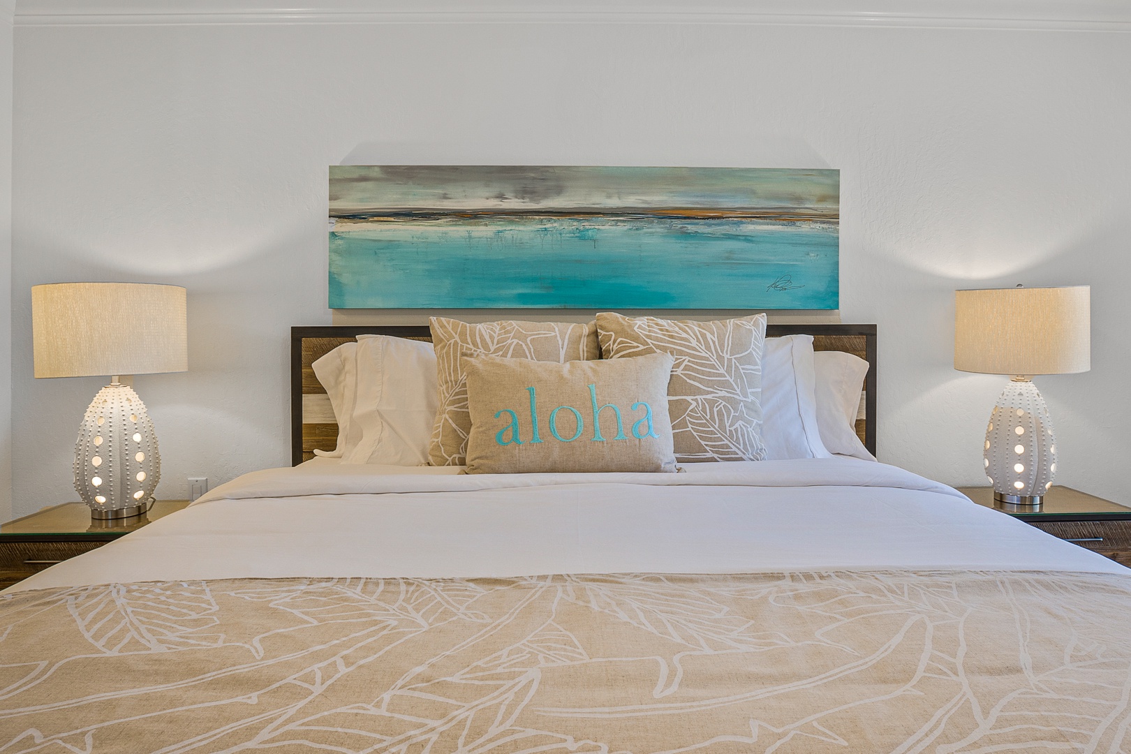 Lahaina Vacation Rentals, Kaanapali Shores 213 - The bedroom offers a cozy king-sized bed with tropical decor, inviting you to relax and unwind.