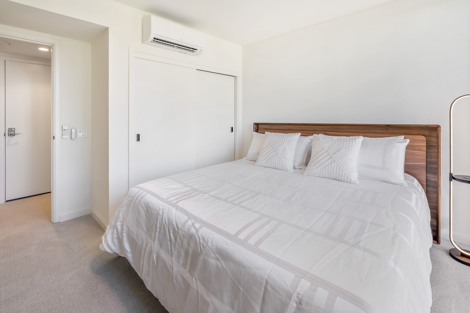 Honolulu Vacation Rentals, Sky Ala Moana #1701 - Cozy bedroom with a comfortable king-sized bed and split AC, perfect for restful nights.