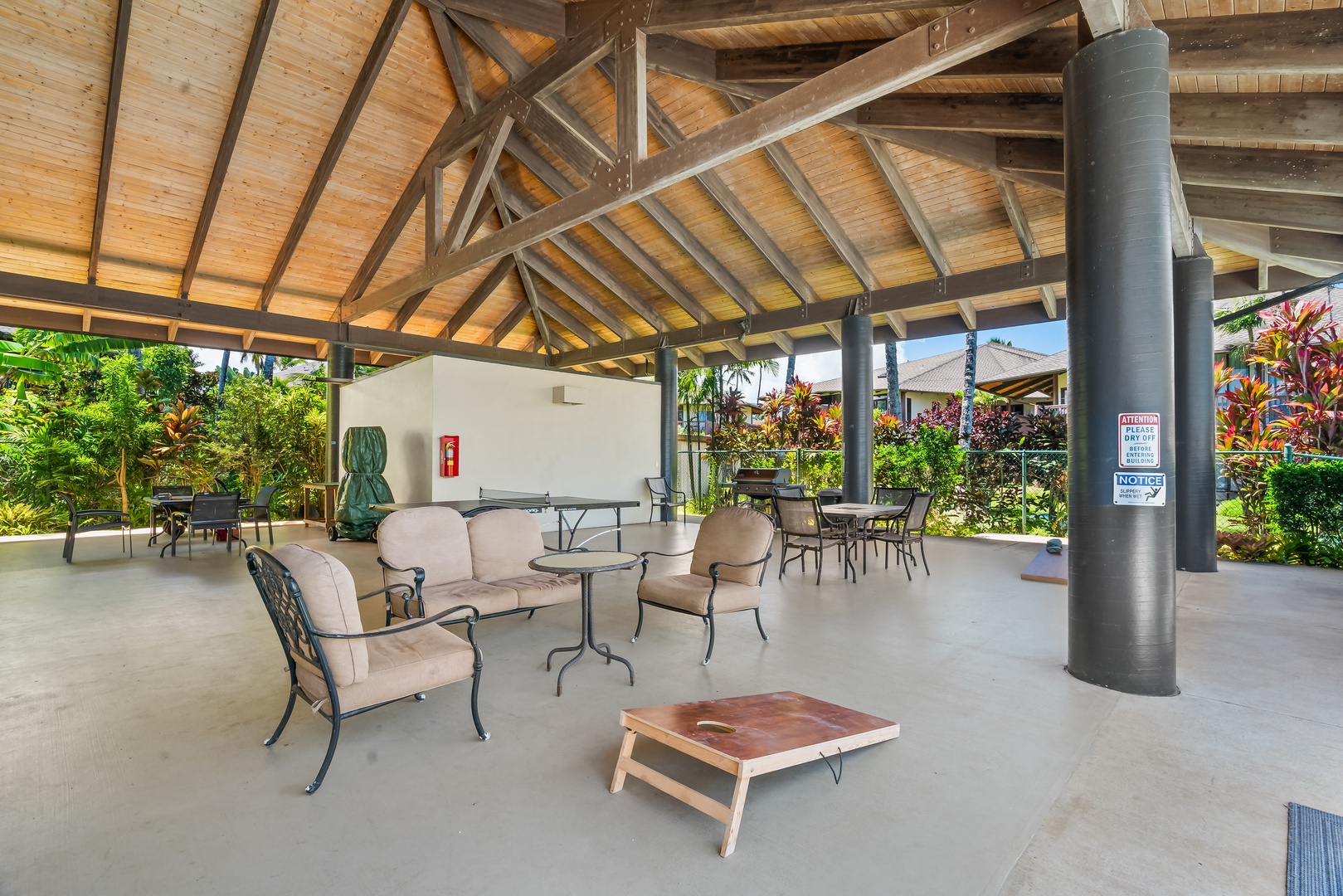 Princeville Vacation Rentals, Mauna Kai 7B - A game of corn hole awaits a audience, comfortable seating for all.
