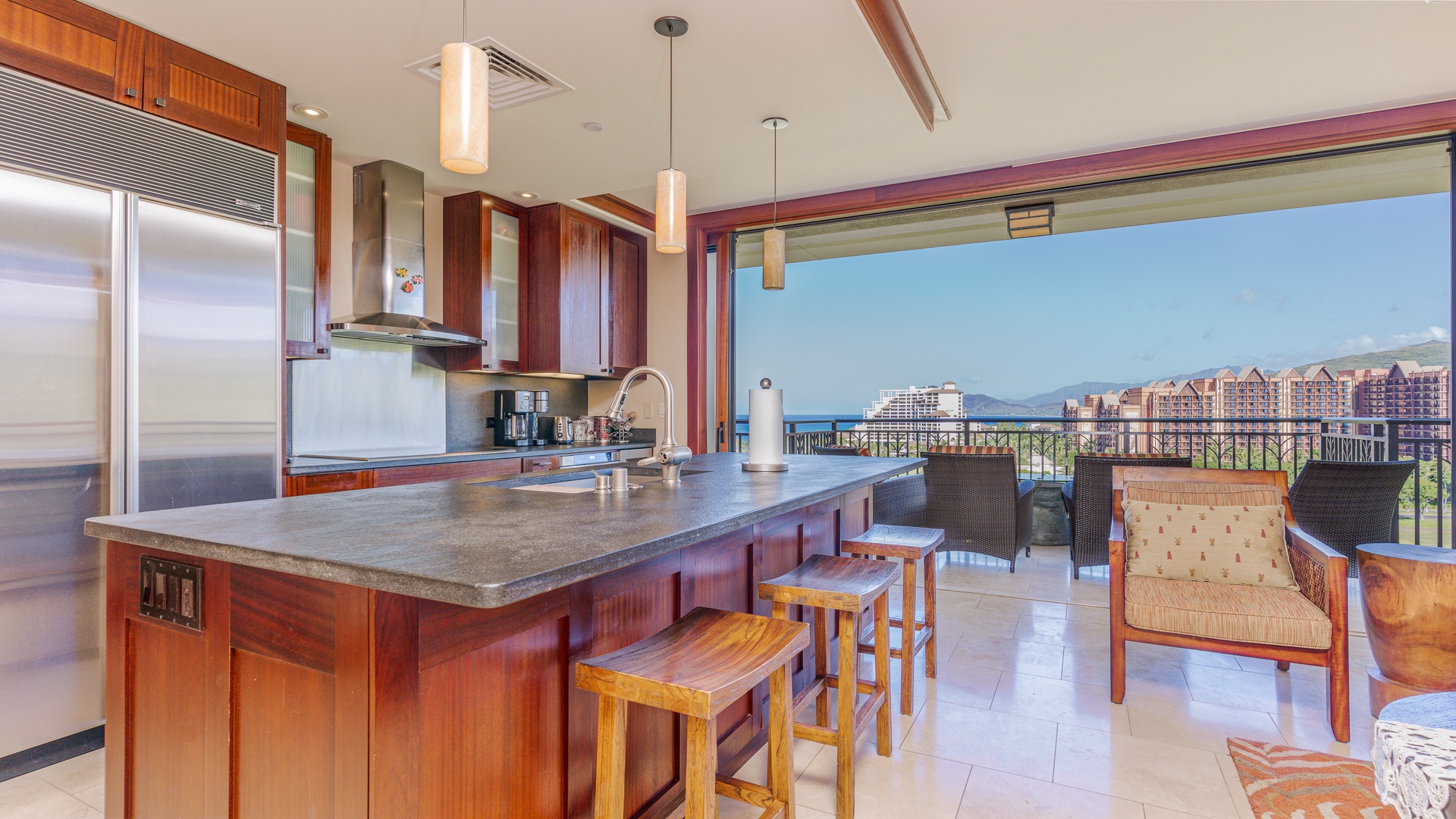 Kapolei Vacation Rentals, Ko Olina Beach Villas B1101 - The kitchen features bar seating, pendant lights and a front row view of sunrises and sunsets.