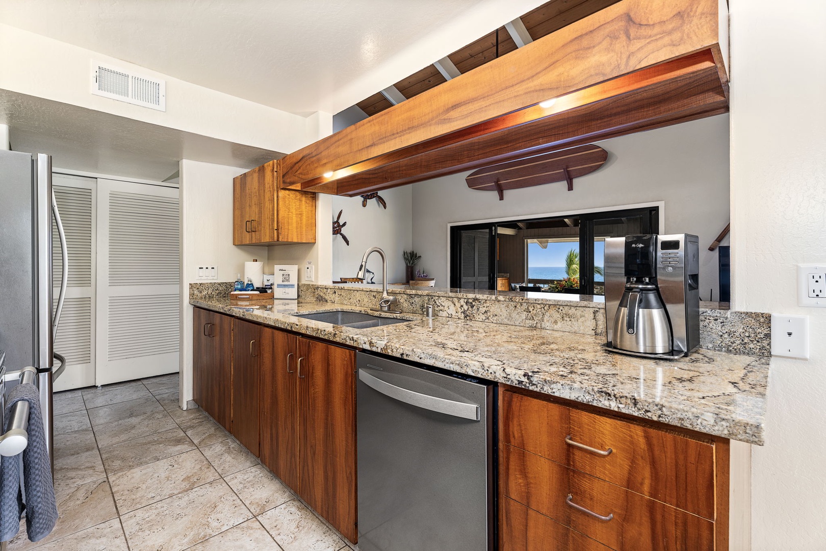Kailua Kona Vacation Rentals, Kanaloa at Kona 1606 - Granite counters catch the morning light through the kitchen window.