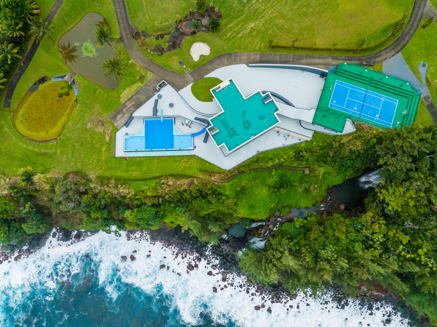 Ninole Vacation Rentals, Waterfalling Estate - Aerial view of this one-of-a-kind clifftop compound
