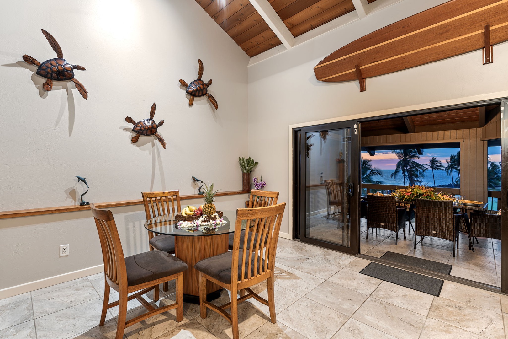 Kailua Kona Vacation Rentals, Kanaloa at Kona 1606 - Gather around the dining table, the lanai open just beyond the glass.