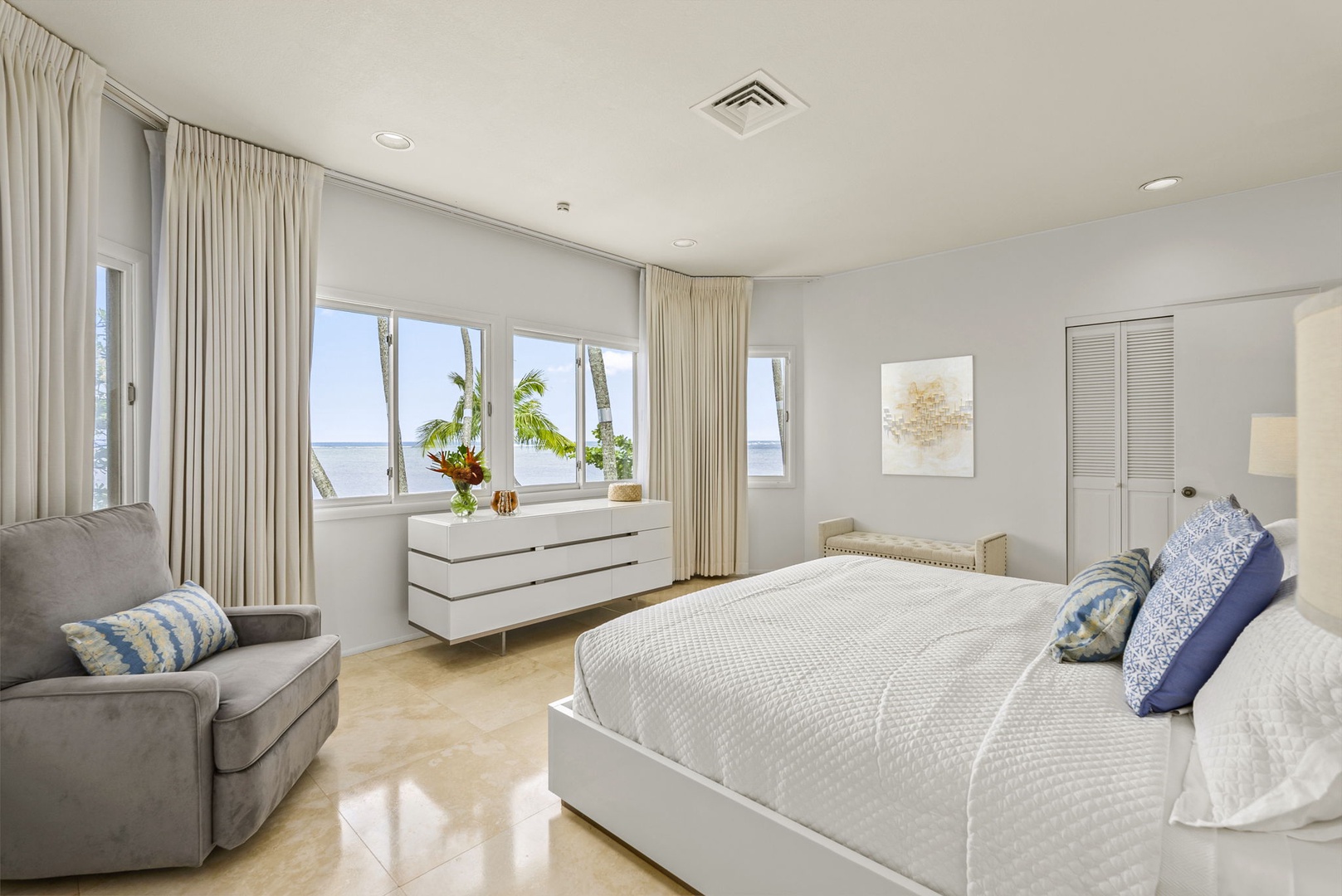 Honolulu Vacation Rentals, Paradise Beach Estate - Wake up to soft natural light and calming ocean views in this tranquil bedroom, styled with minimalist elegance and comfort.