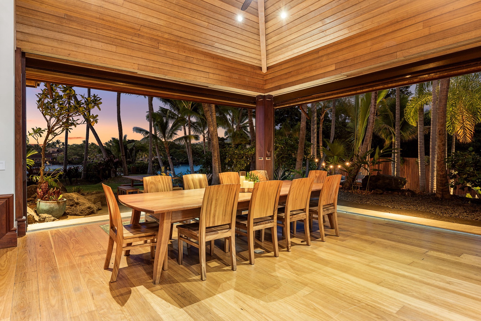 Kailua-Kona Vacation Rentals, Hahalua Bay Villa - Gather around this stunning dining table where tropical sunsets frame your meals through floor-to-ceiling windows.